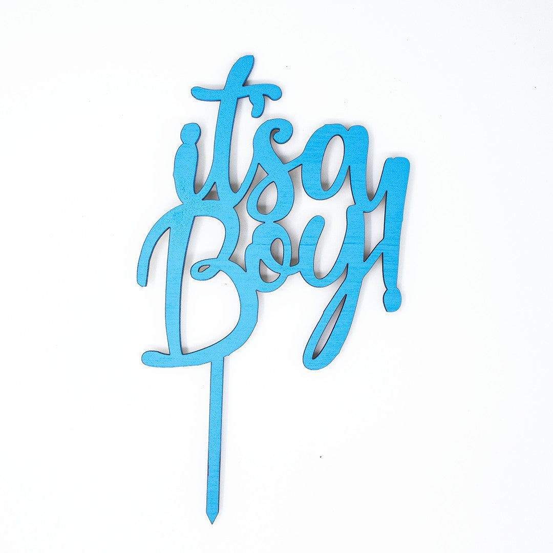 Wooderland blue wooden It's a Boy cake topper with playful laser-cut lettering for baby showers and gender reveals.