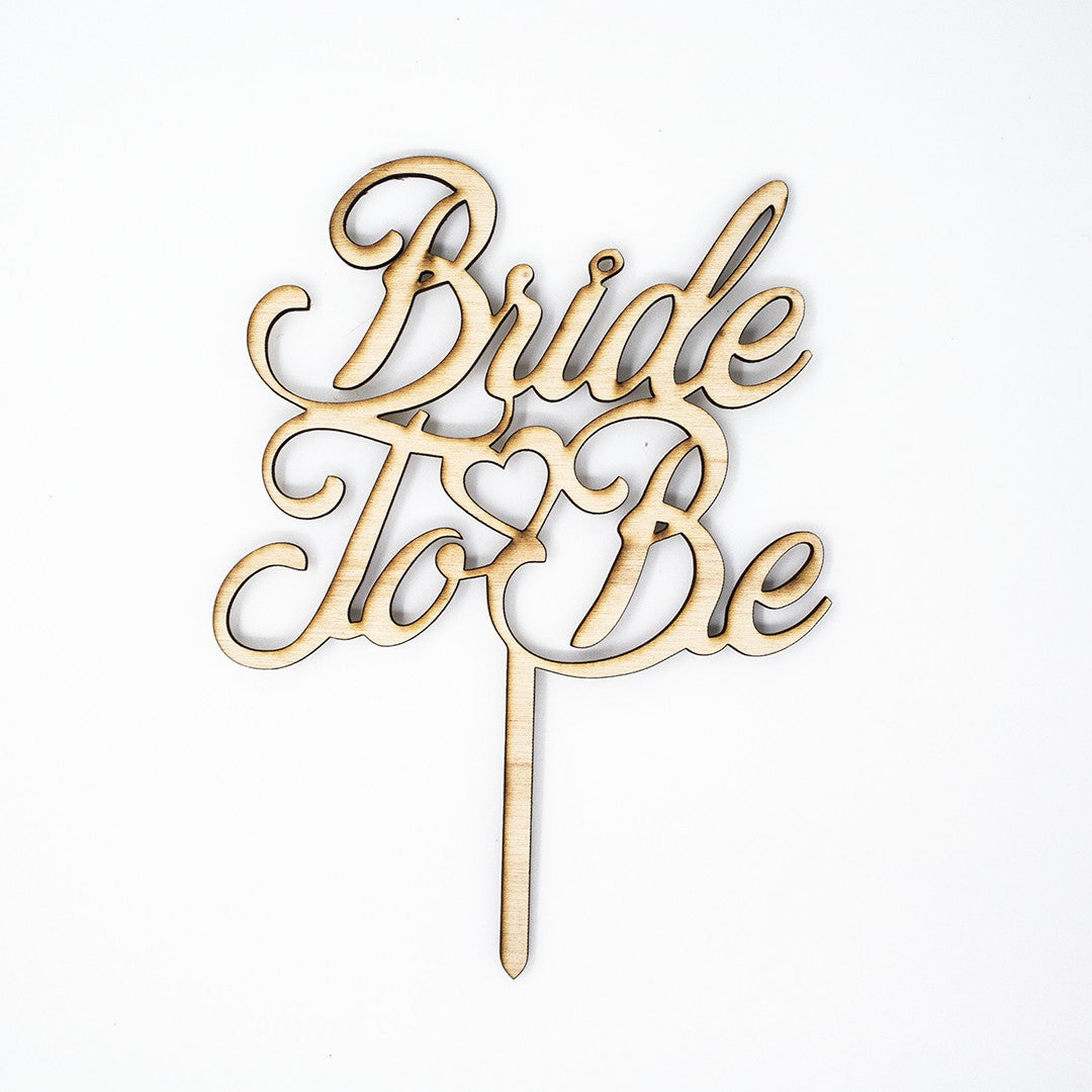 Wooderland Bride to Be wooden cake topper with elegant laser-cut script and a heart detail for bridal showers.
