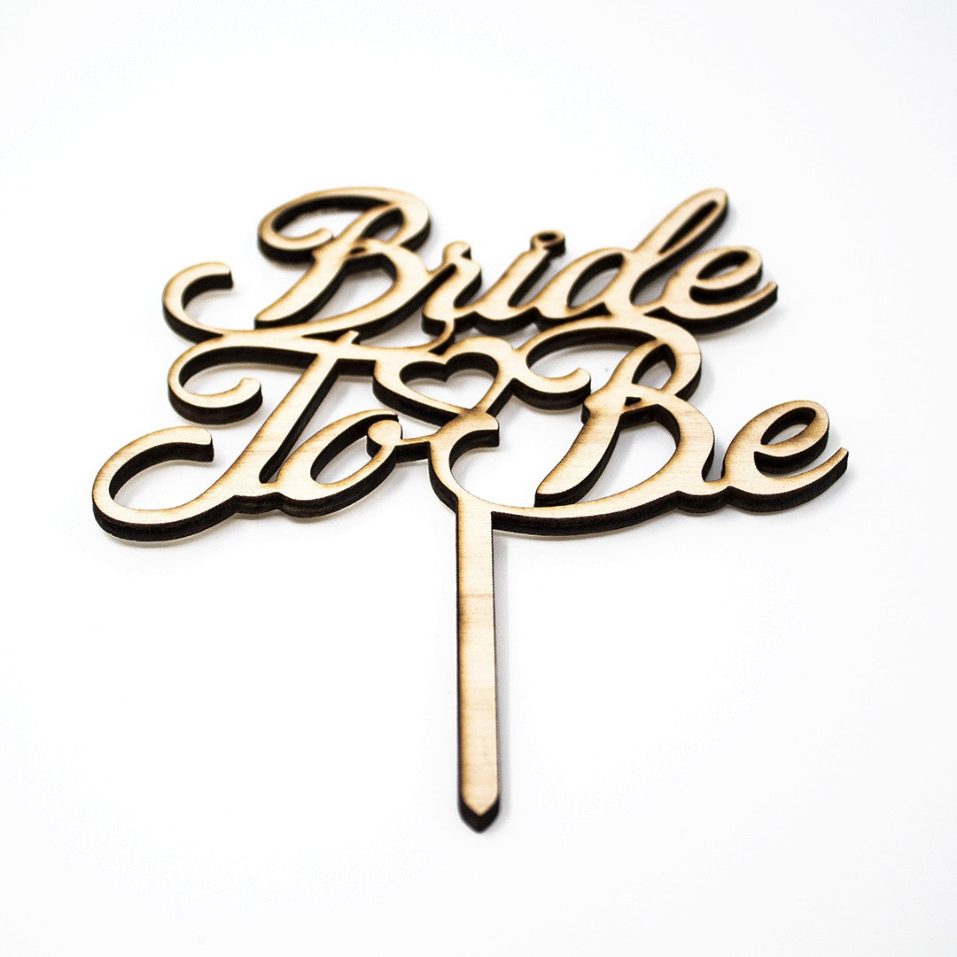 Wooderland Bride to Be wooden cake topper in natural plywood with elegant laser-cut script for bridal showers.