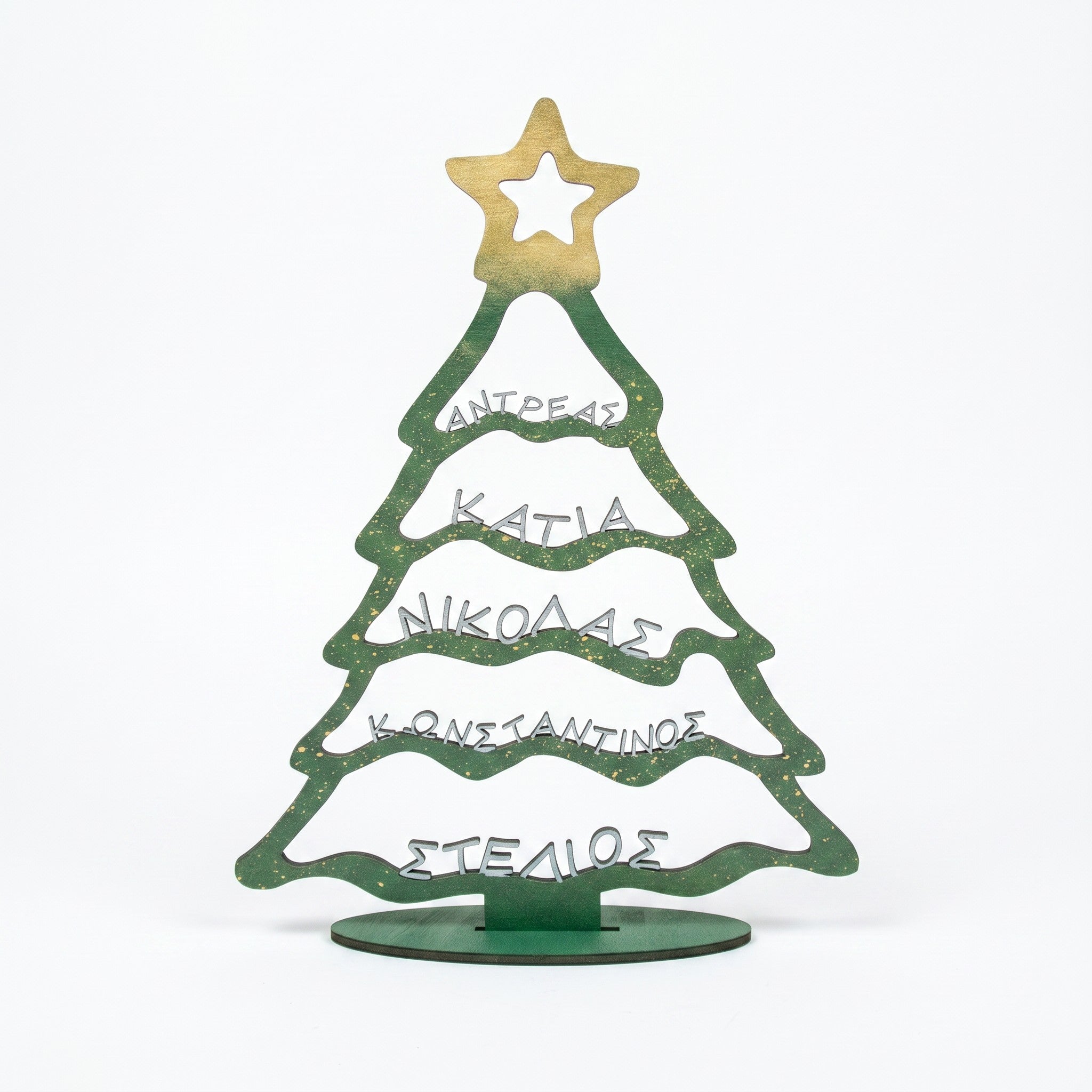 Wooderland custom plywood Christmas tree with green finish, gold star topper, and engraved family names.