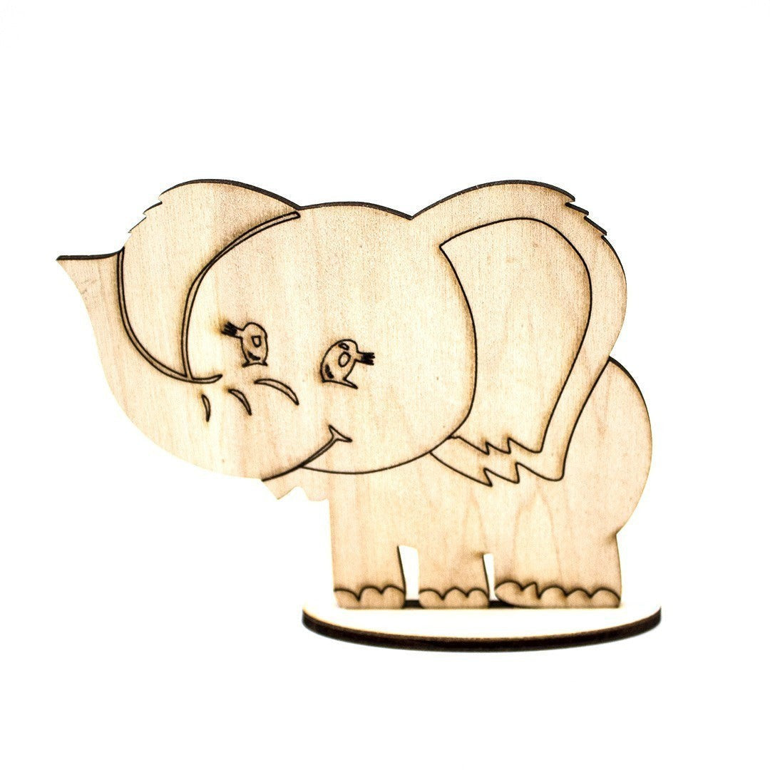 Wooderland custom laser-cut wooden elephant figure on a small circular base for event decor or party favors.
