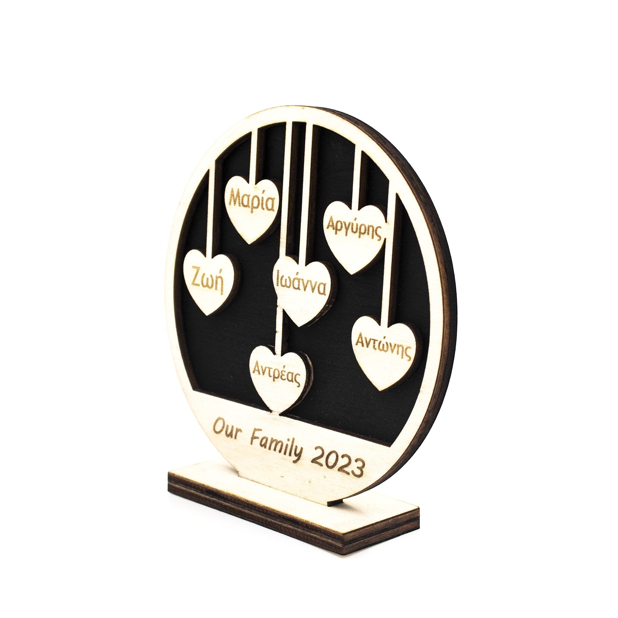 Wooderland custom wooden family circle sign with hanging heart ornaments engraved with names on a stand.