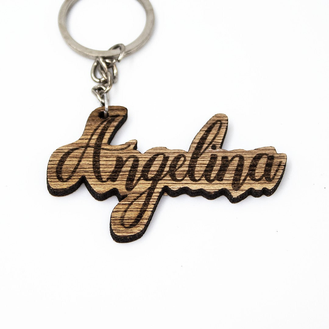Wooderland custom laser-engraved wooden name keyring with Angelina in elegant cursive script