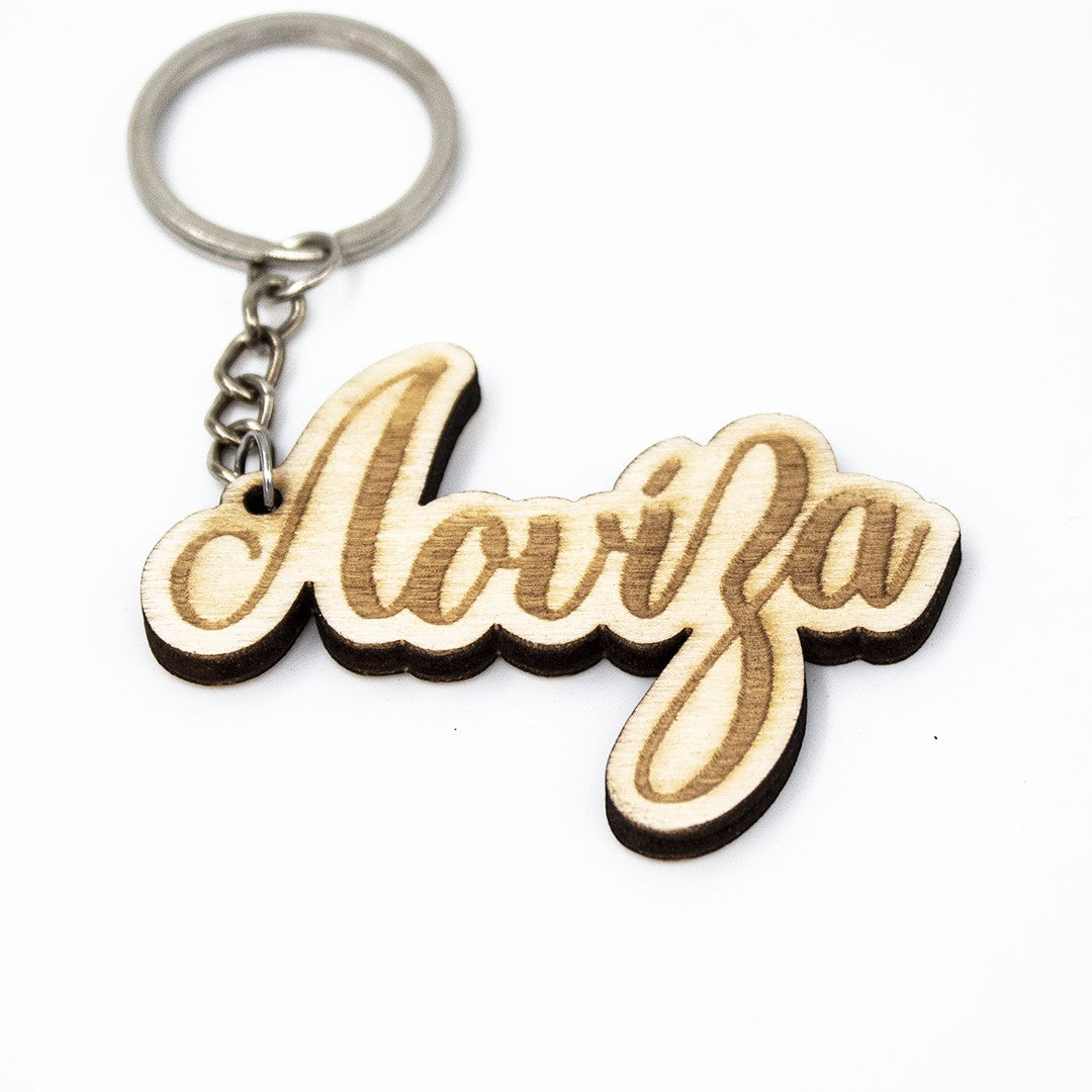 Wooderland custom wooden keyring featuring the name Aoviza in elegant cursive laser-engraved script on a metal ring.