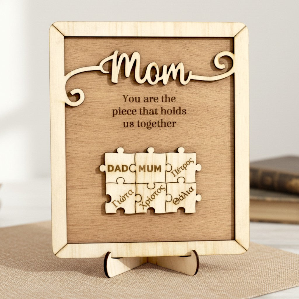Wooderland custom wooden puzzle plaque for Mom with engraved message and personalized name puzzle pieces on a stand.