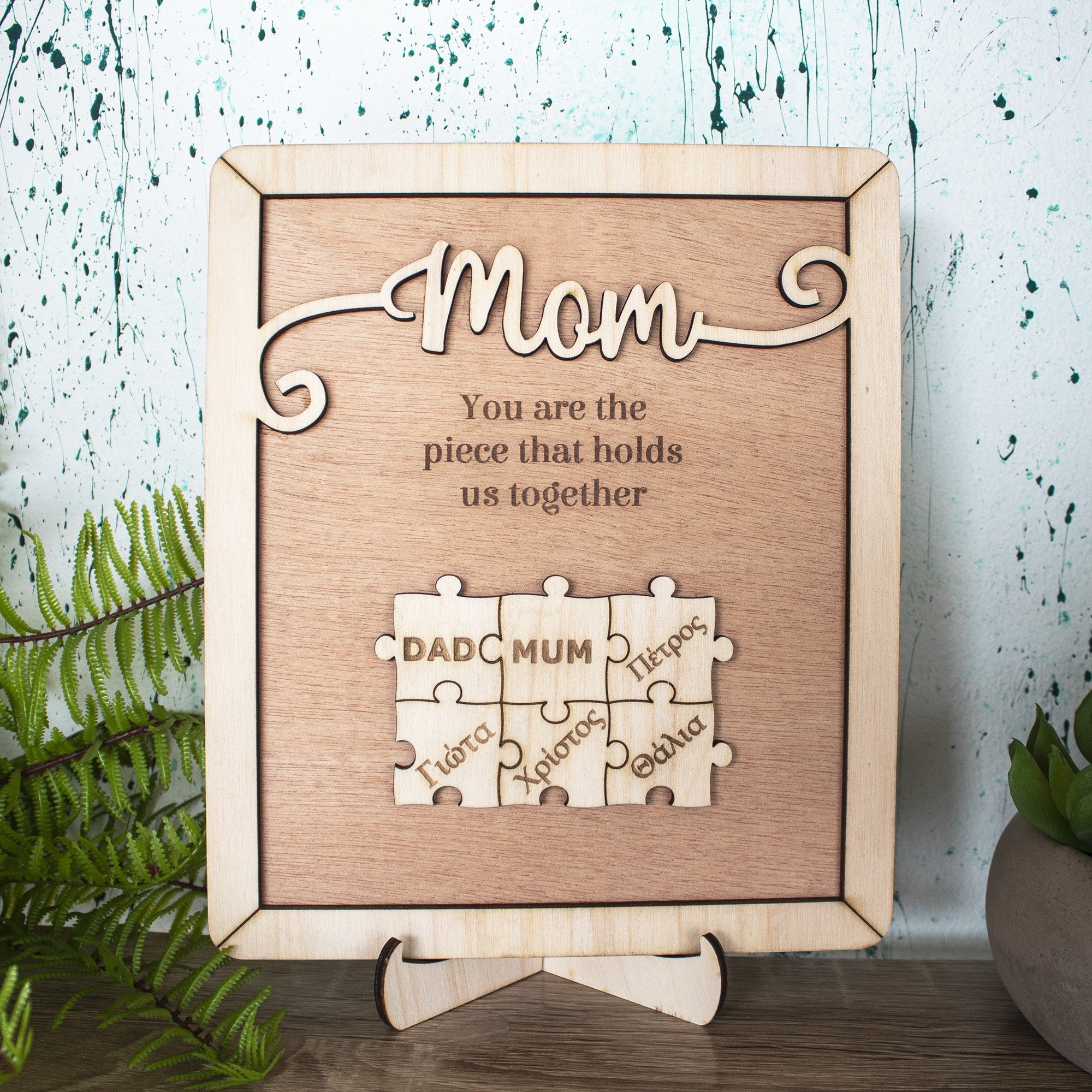 Wooderland custom wooden puzzle plaque for Mom with engraved names and heartfelt message on a display stand.
