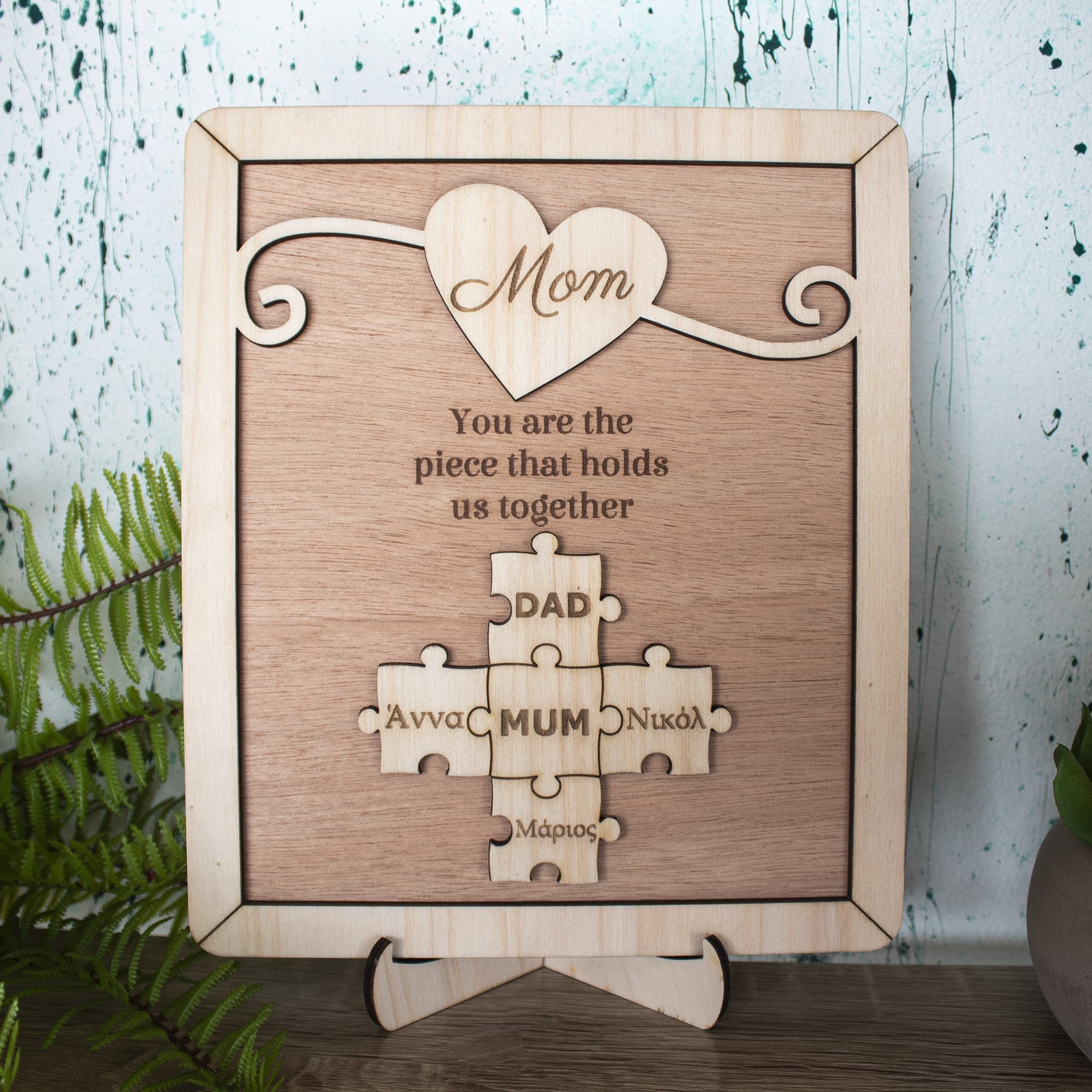 Wooderland custom wooden puzzle plaque for Mom featuring a heart design and personalized family name puzzle pieces.