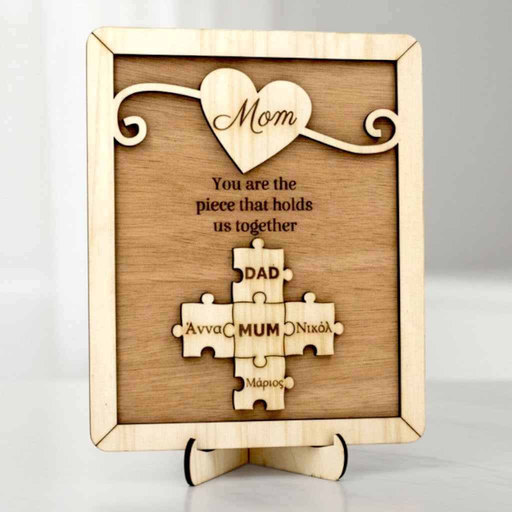 Wooderland custom wooden puzzle plaque for Mom featuring a heart design and personalized family name puzzle pieces.