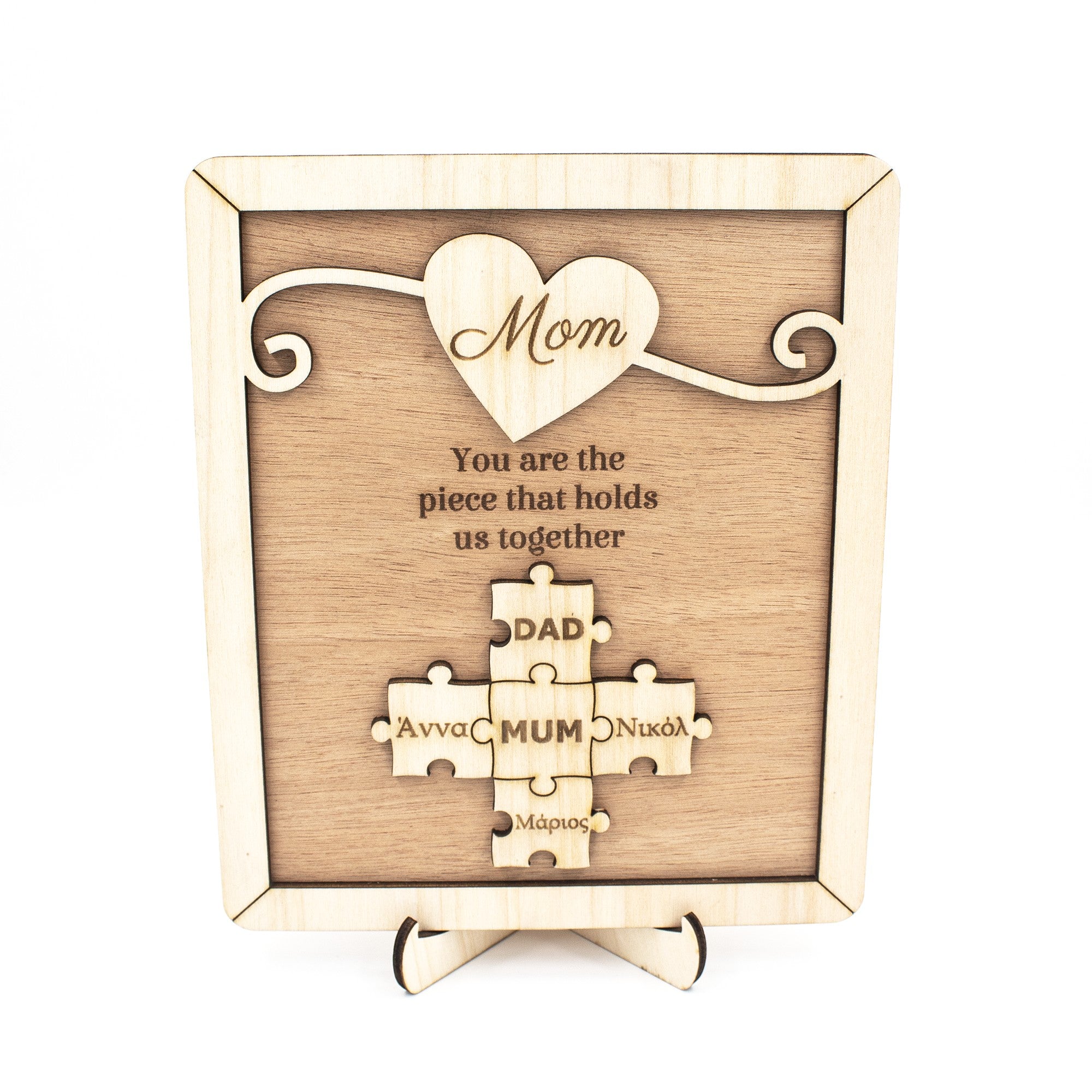 Wooderland custom wooden puzzle plaque for Mom with engraved heart and family names on a display base.