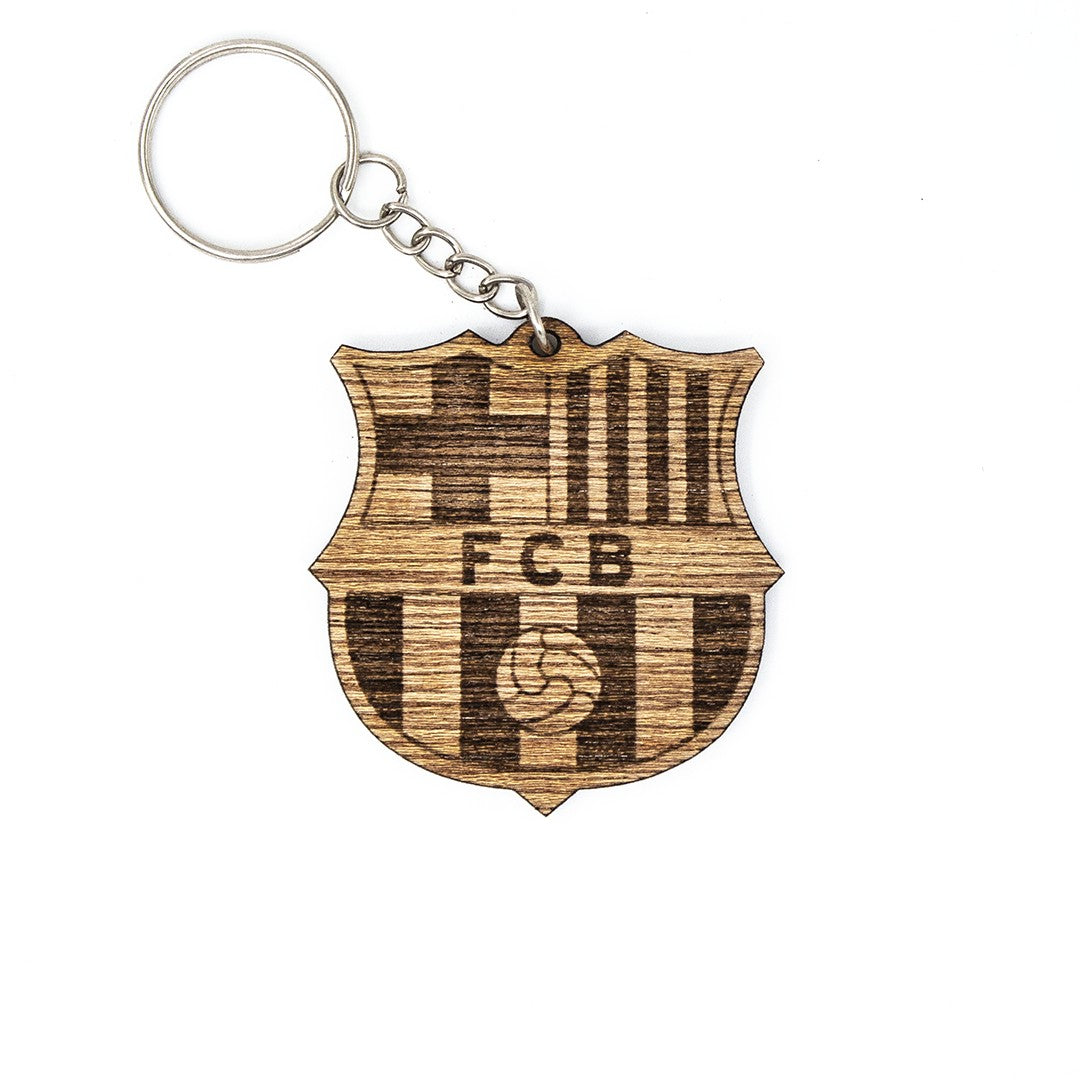 Wooderland customized wooden keyring featuring an engraved FC Barcelona sports team logo on a shield-shaped pendant.