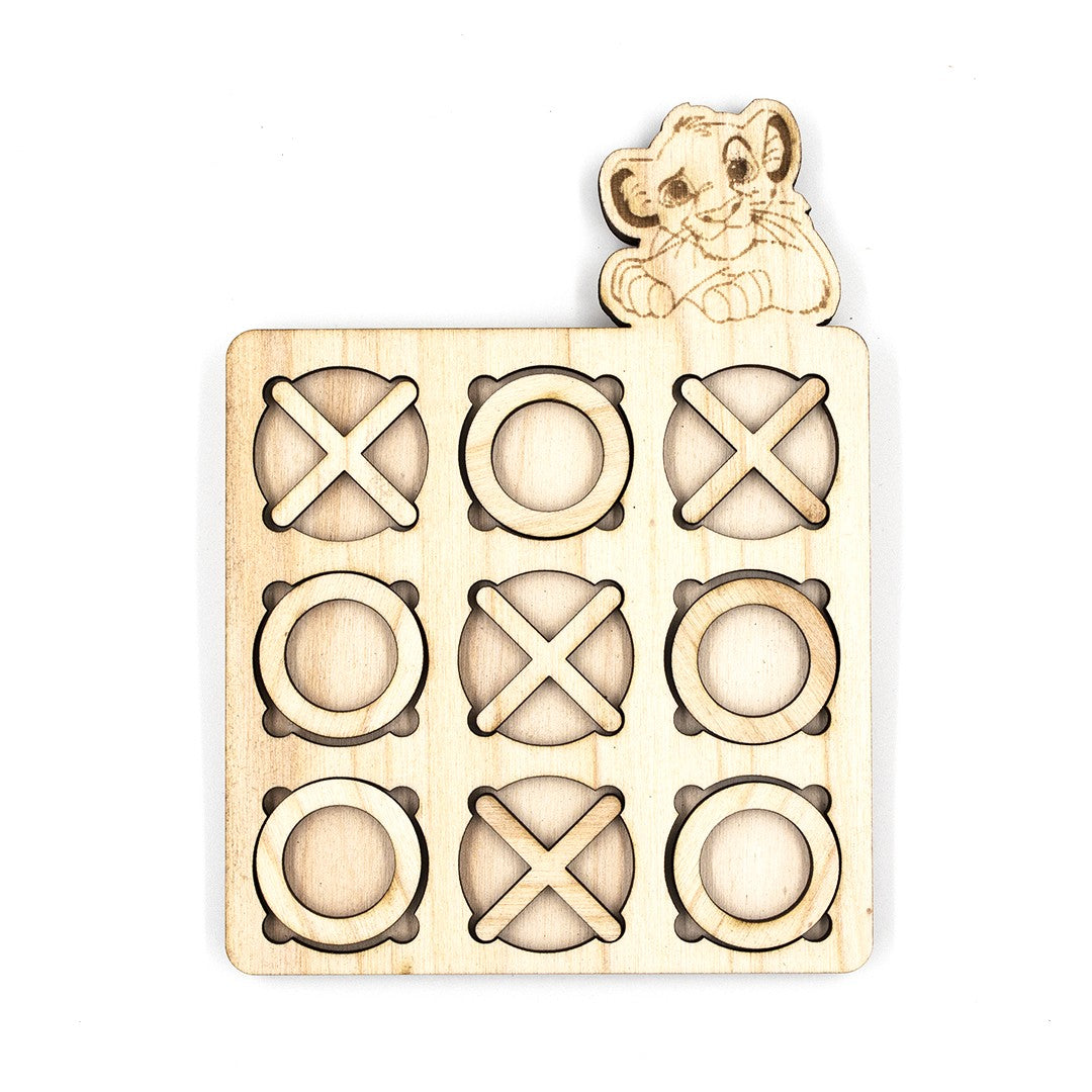 Wooderland custom wooden tic-tac-toe game board featuring a laser-engraved lion cub figure on a light wood finish.