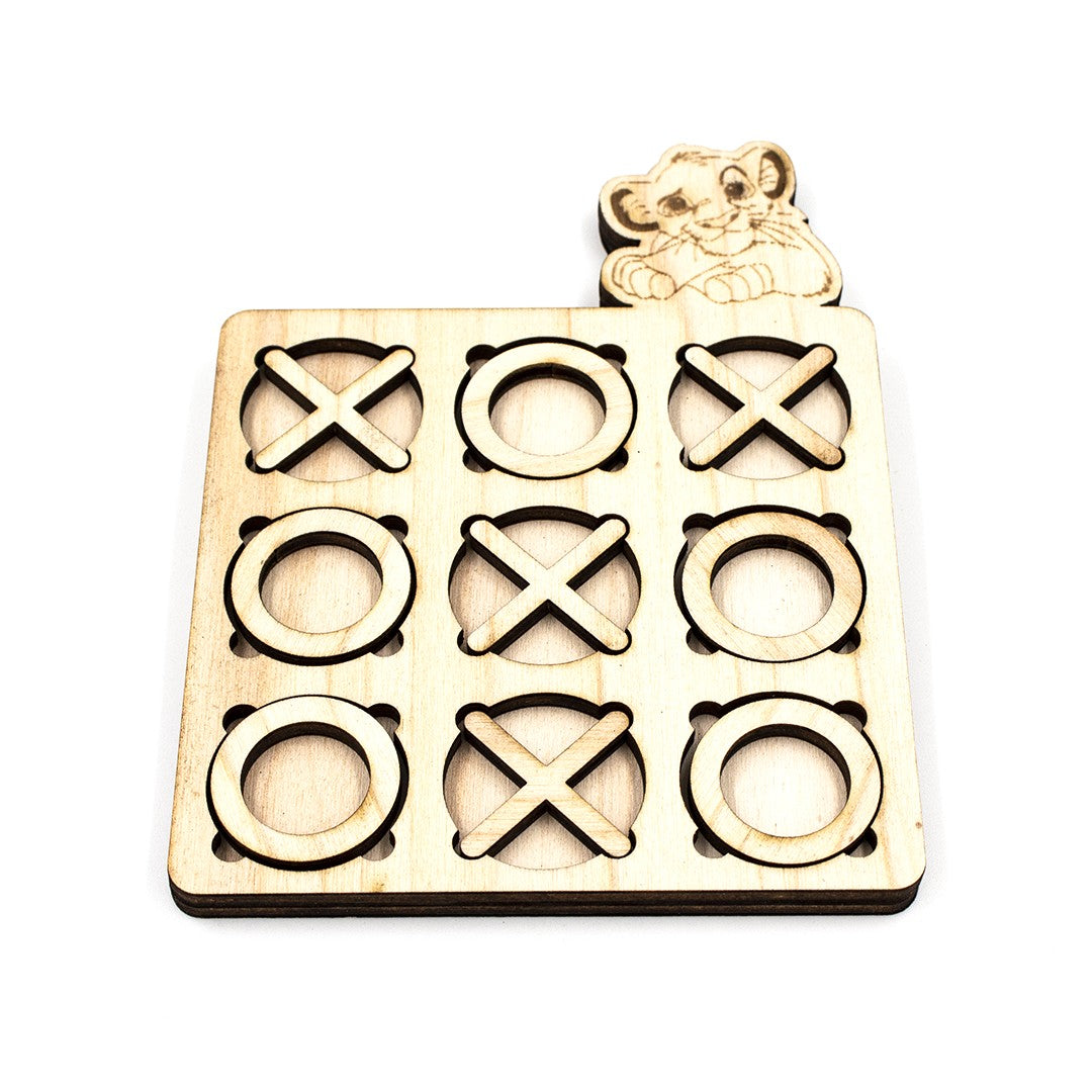 Wooderland custom wooden tic-tac-toe game board with laser-engraved lion cub figure and X and O pieces