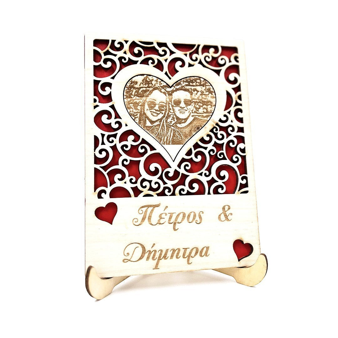 Wooderland custom engraved wooden portrait with a heart-shaped photo frame, red background, and personalized text.
