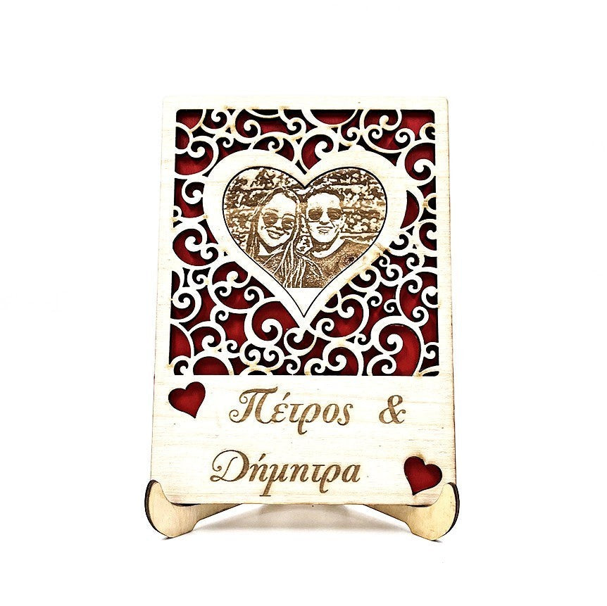 Wooderland custom engraved wooden portrait with a couple's photo in a heart frame and personalized text on a stand.