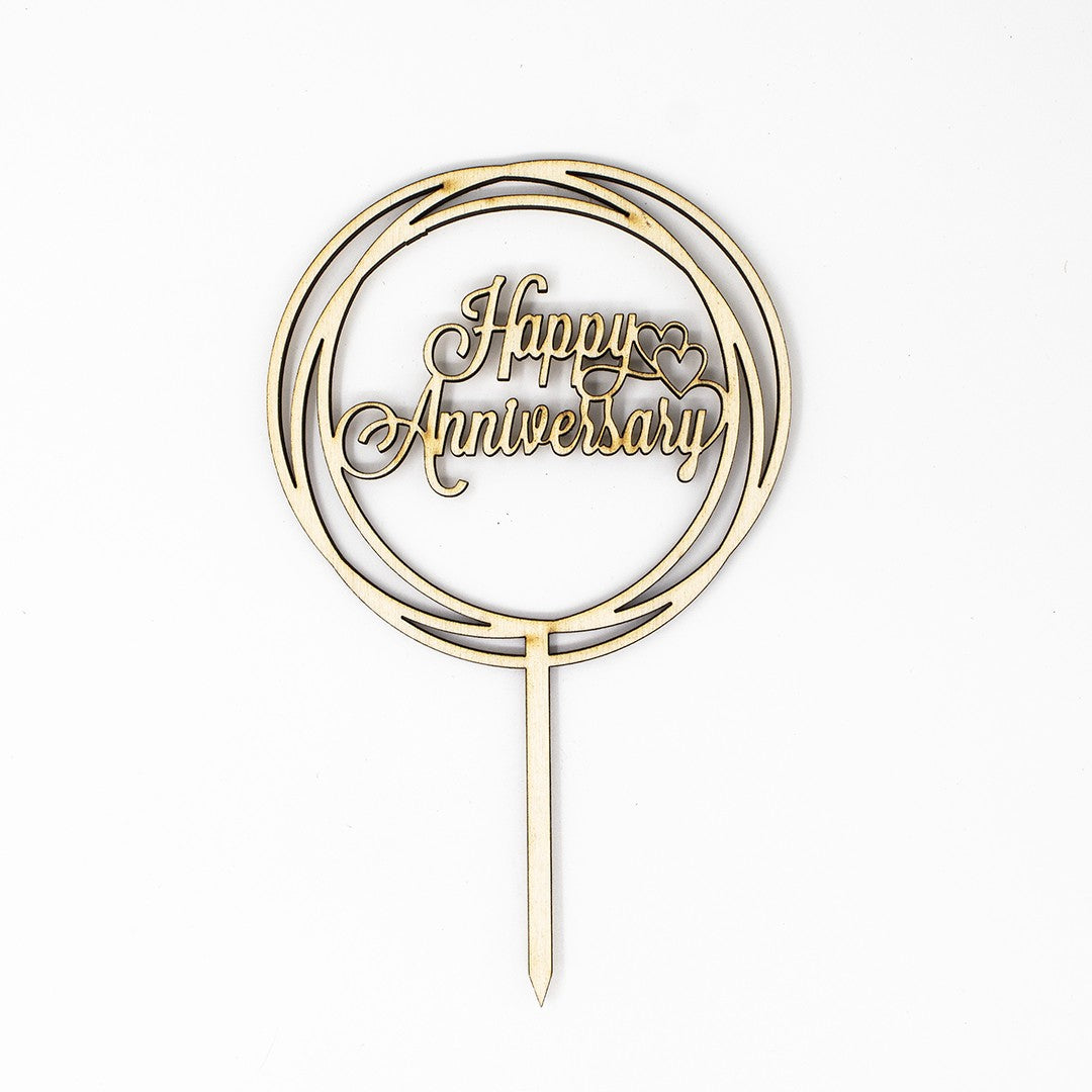 Wooderland laser-cut wooden Happy Anniversary cake topper with elegant script and circular frame design.