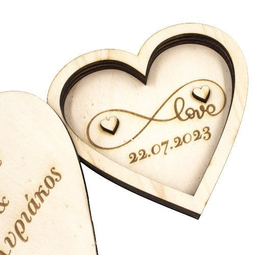 Wooderland heart-shaped wooden wedding ring box with engraved infinity symbol, love text, and wedding date.