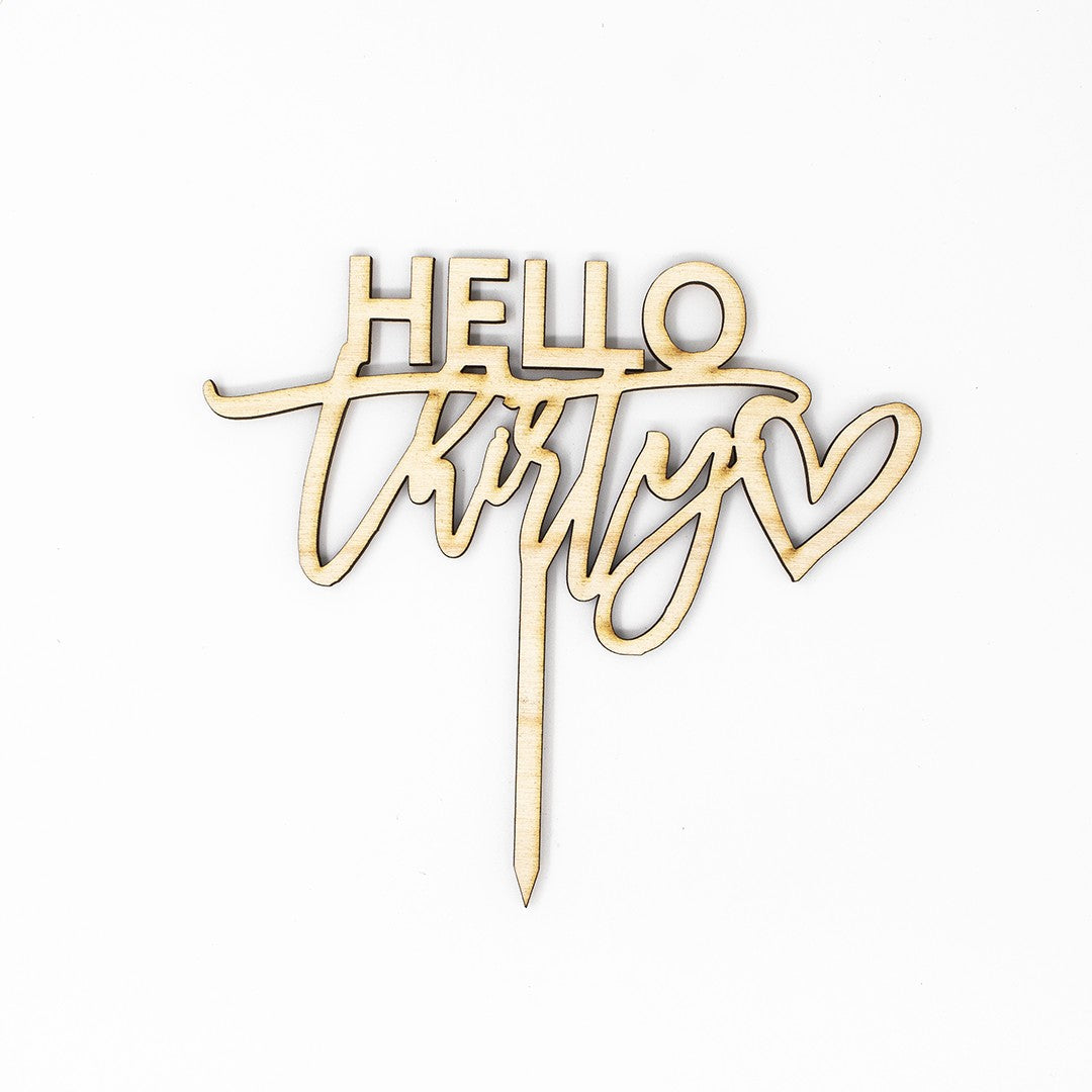 Wooderland Hello Thirty wooden cake topper with laser-cut script and heart detail for a 30th birthday celebration.