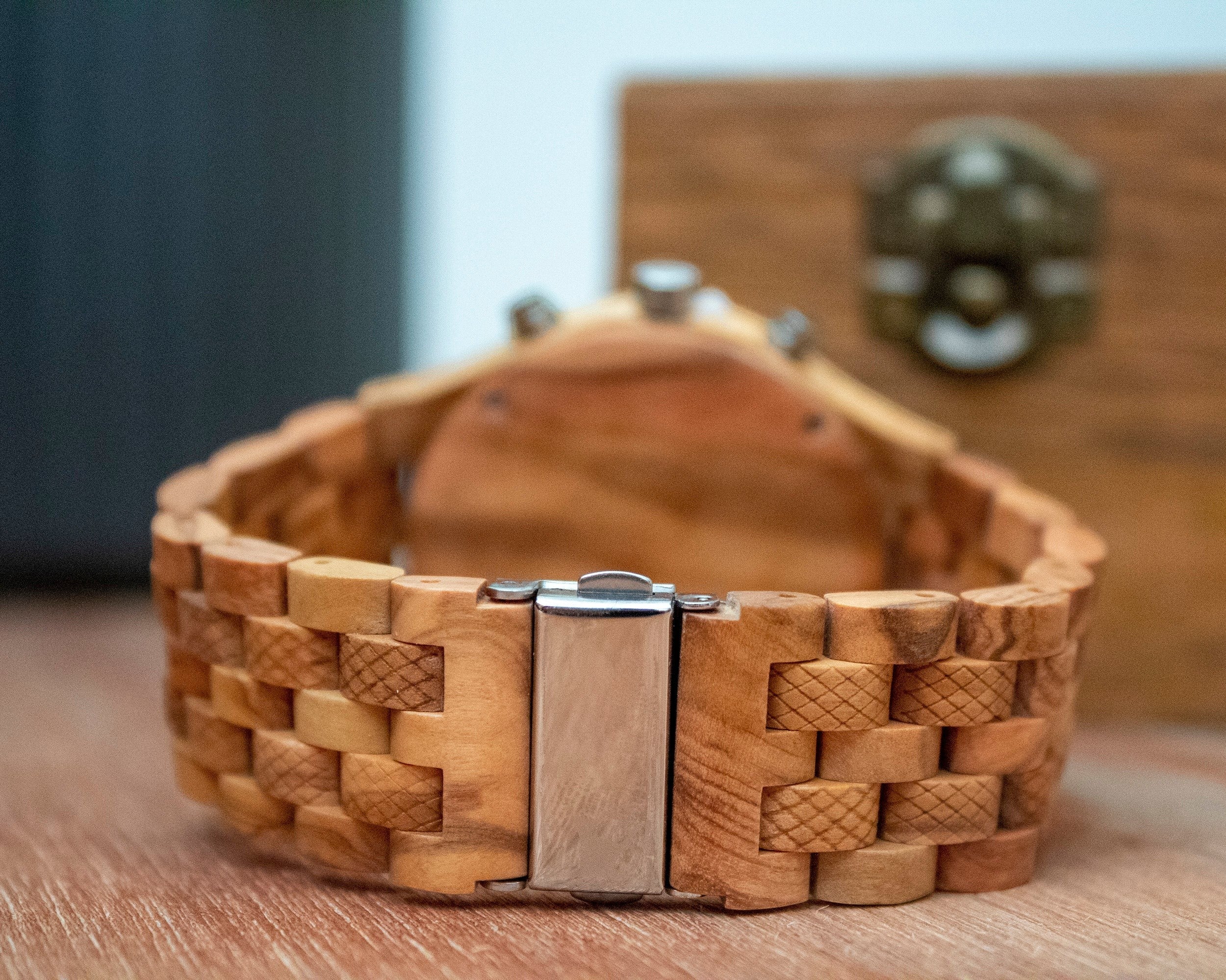 Wooderland Jupiter wooden wristwatch featuring a textured link band and a silver metal clasp closure.