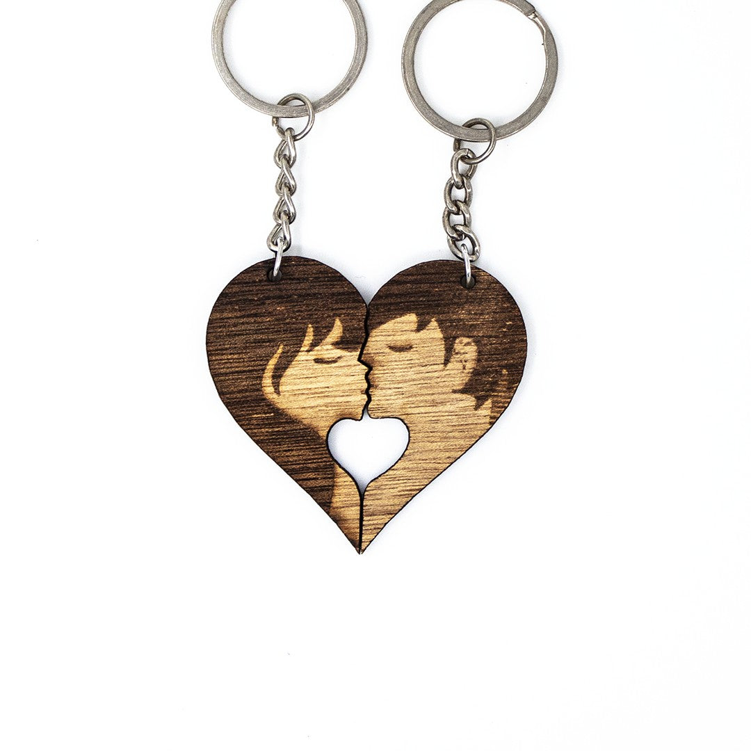 Wooderland Kiss Me wooden heart keyrings featuring a laser-engraved couple silhouette for couples or best friends.