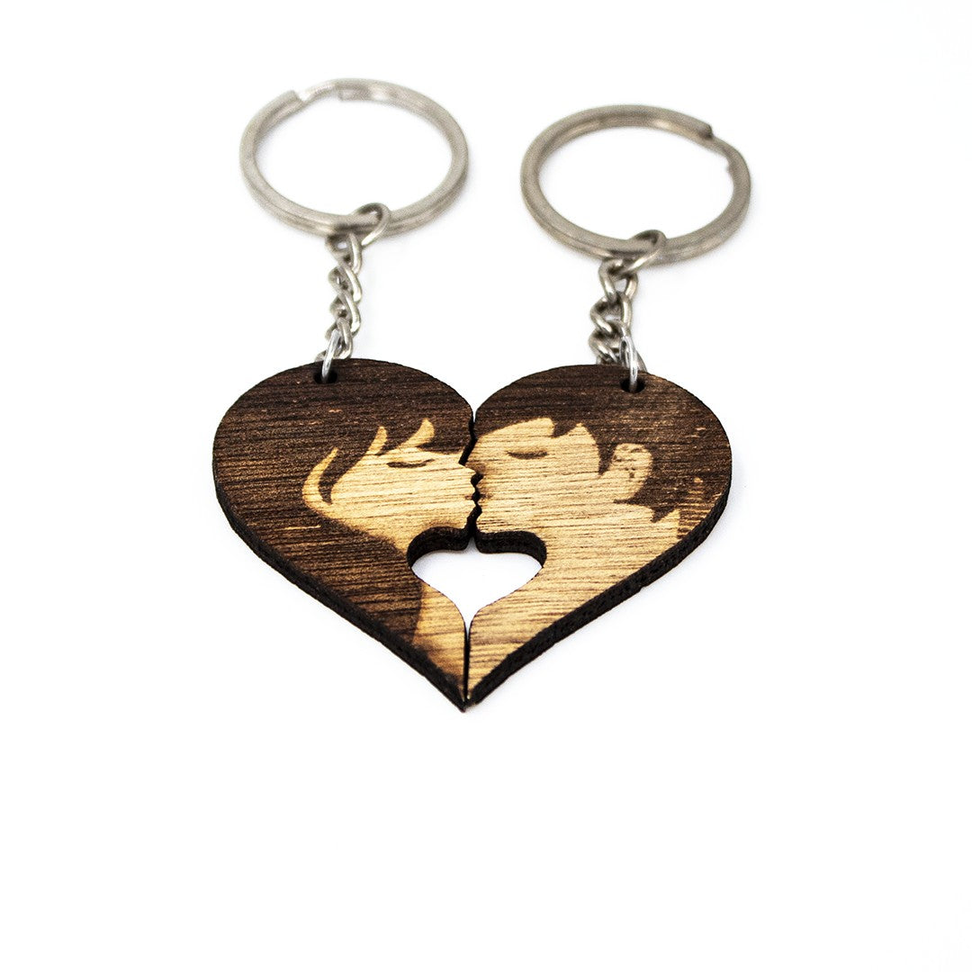 Wooderland Kiss Me wooden heart keyrings featuring a laser-engraved couple silhouette for couples or best friends.