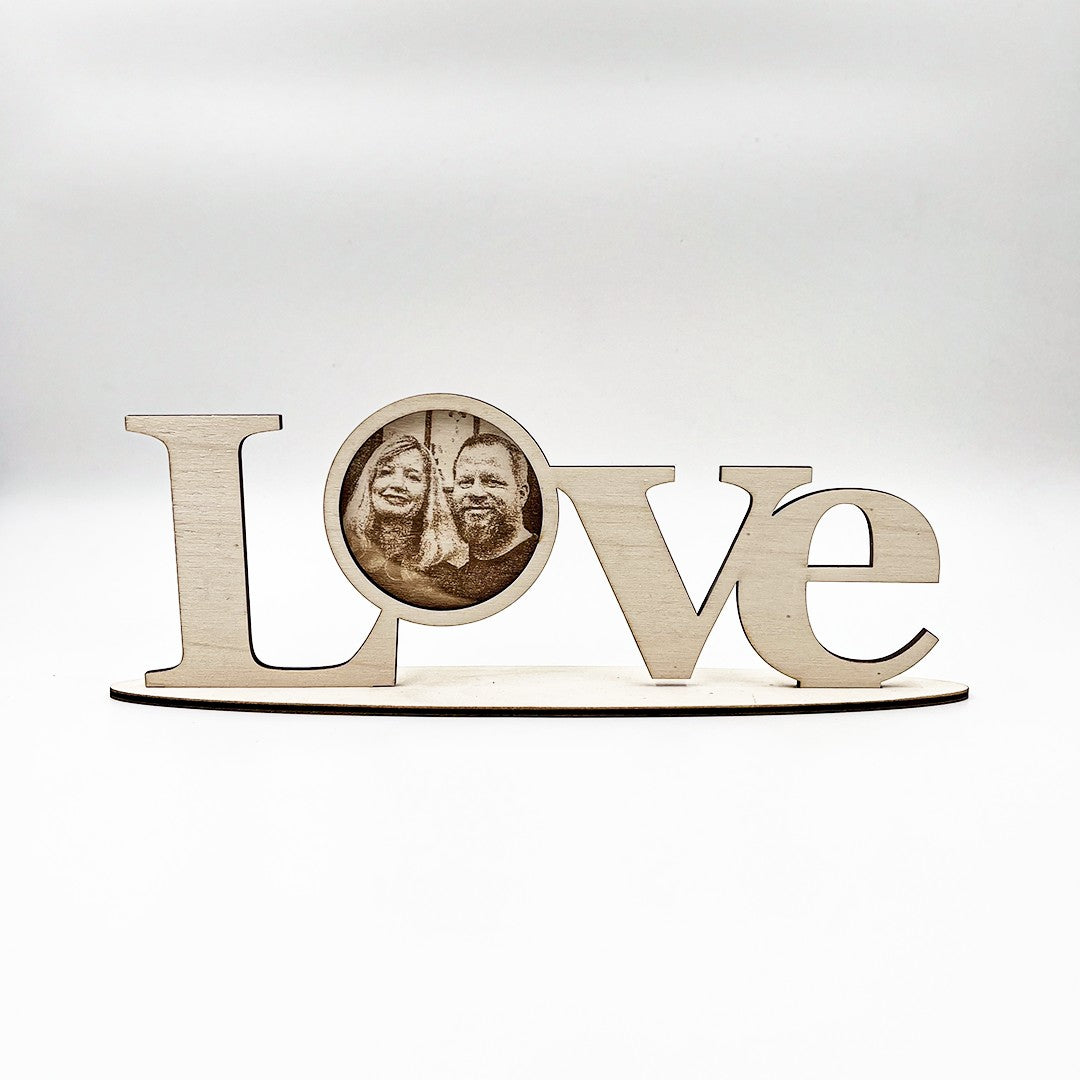 Wooderland laser-cut wooden LOVE standing letters with a personalized circular photo insert for shelf decor.