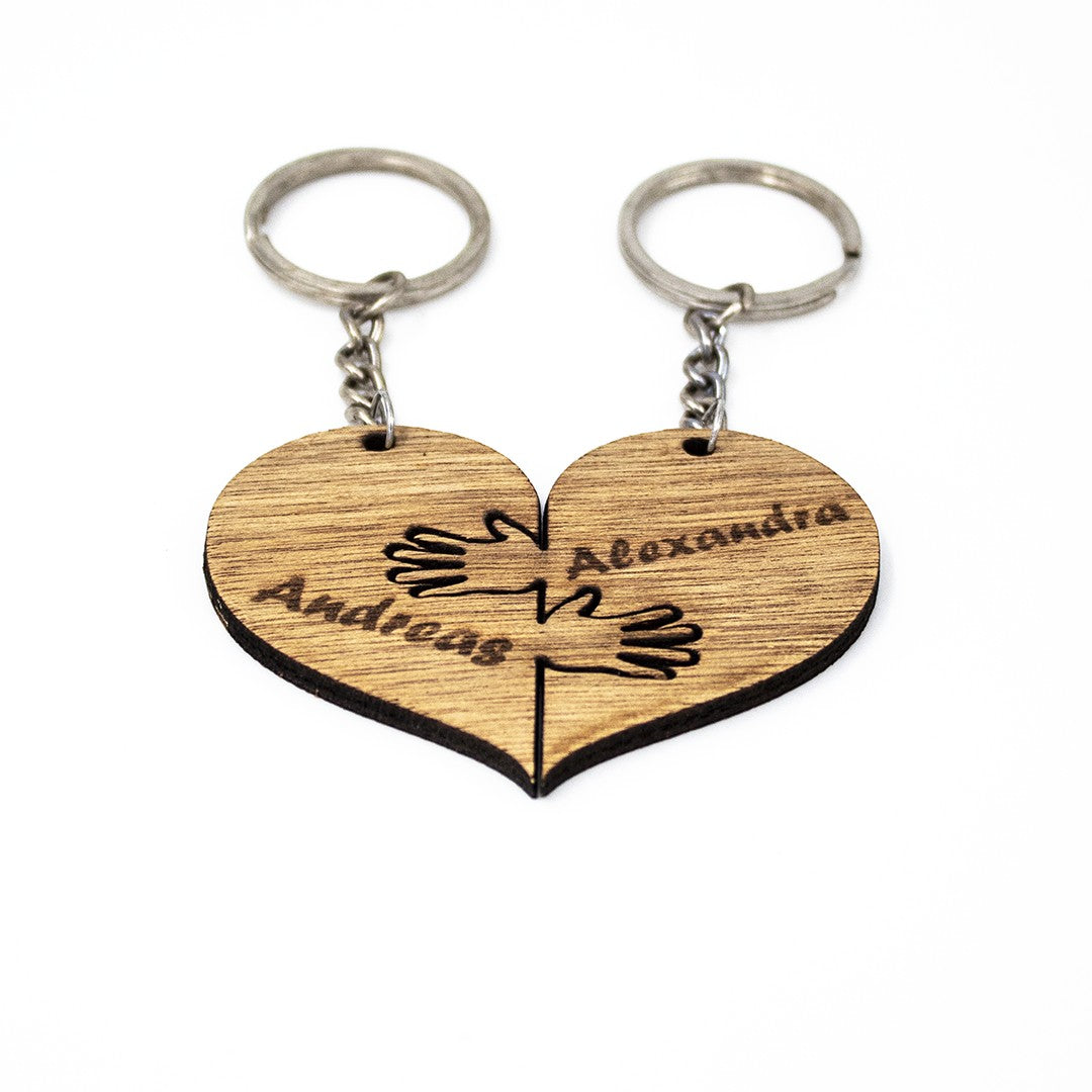 Wooderland matching wooden heart keyrings with engraved names and hugging hands design for couples or best friends