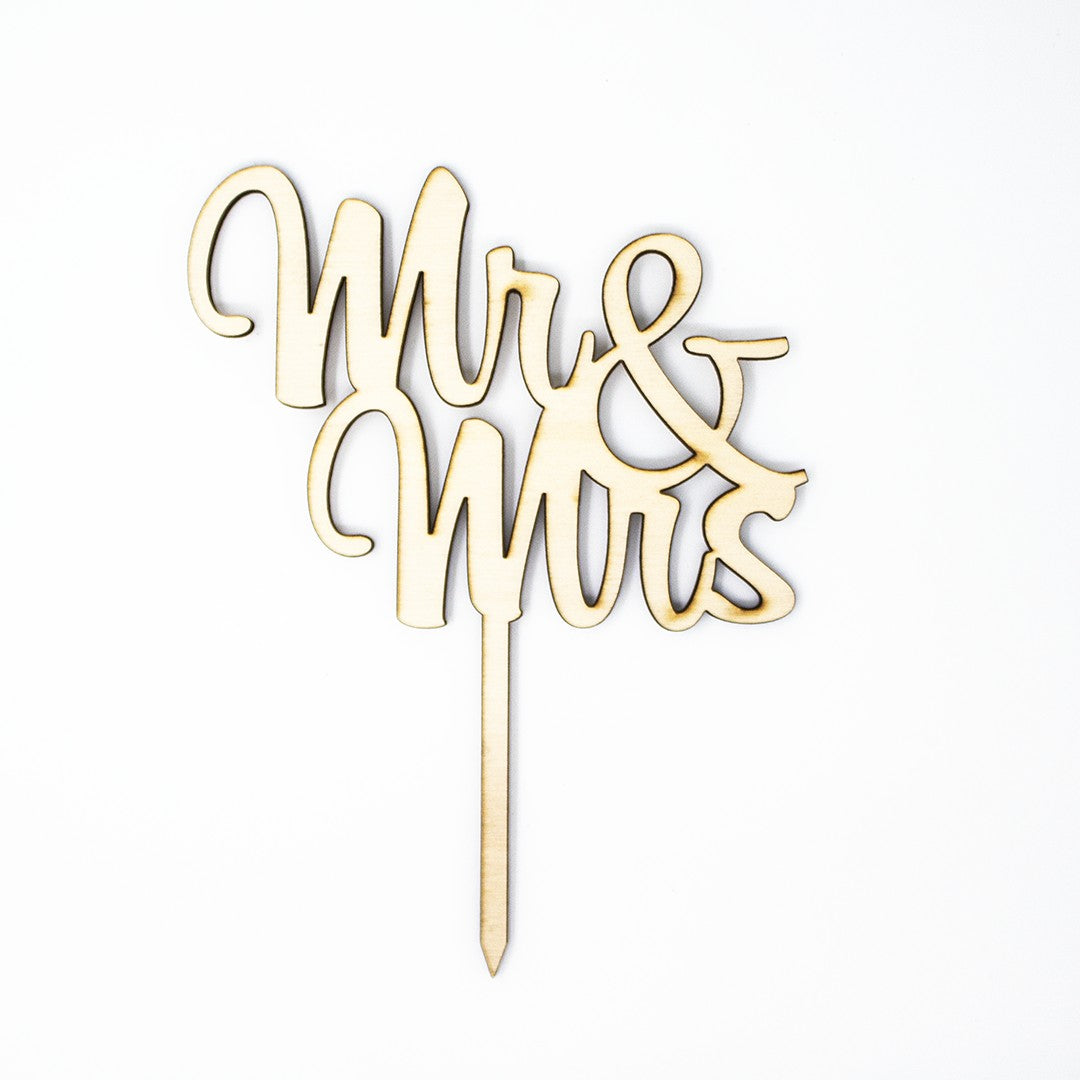 Wooderland Mr & Mrs wooden wedding cake topper with elegant laser-cut script and a smooth natural wood finish.