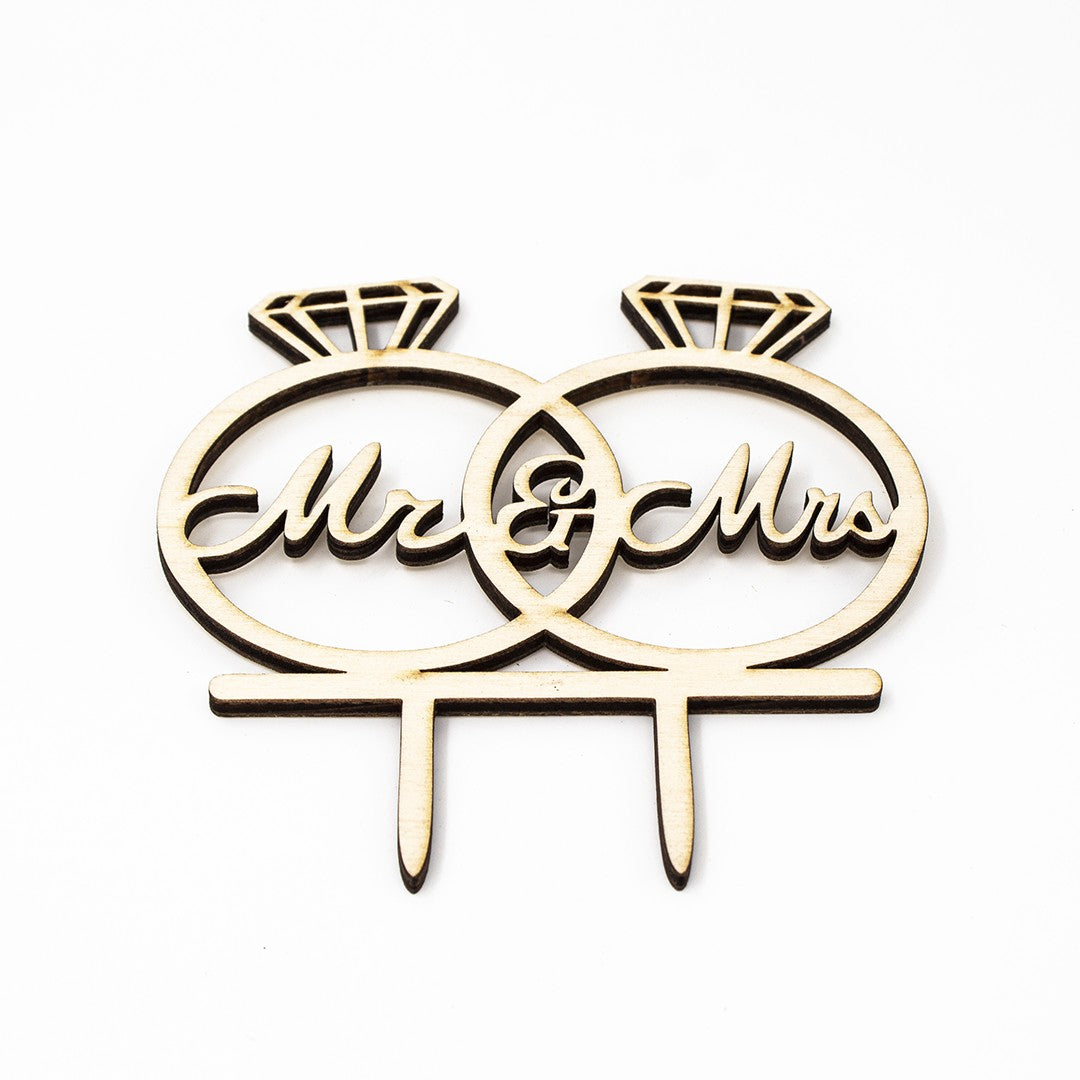 Wooderland Mr & Mrs wooden wedding cake topper featuring two interlocking diamond rings in laser-cut script