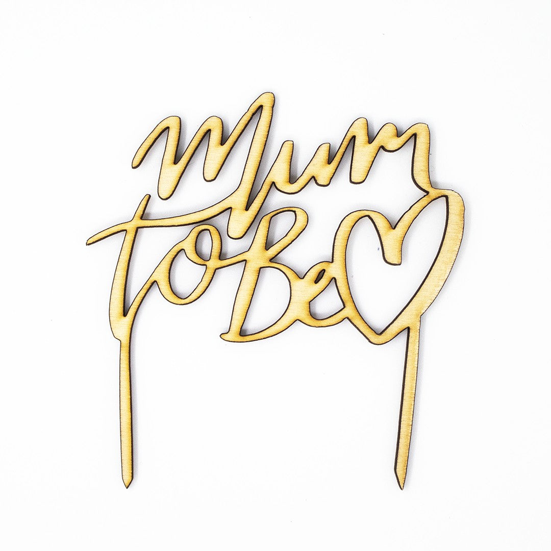 Wooderland Mum to Be wooden cake topper with laser-cut script and heart detail for baby shower celebrations.