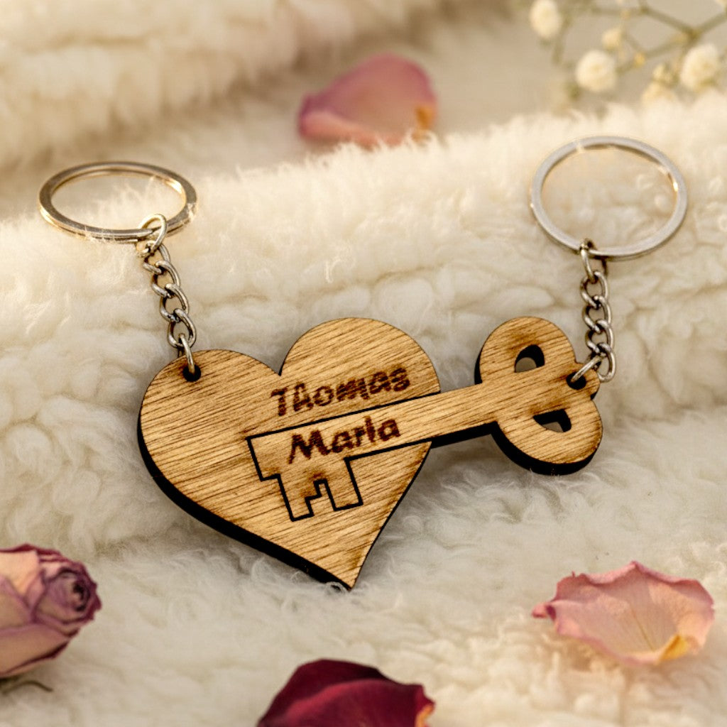 Wooderland personalised wooden heart and key keyring set with engraved names on a soft white textured background.