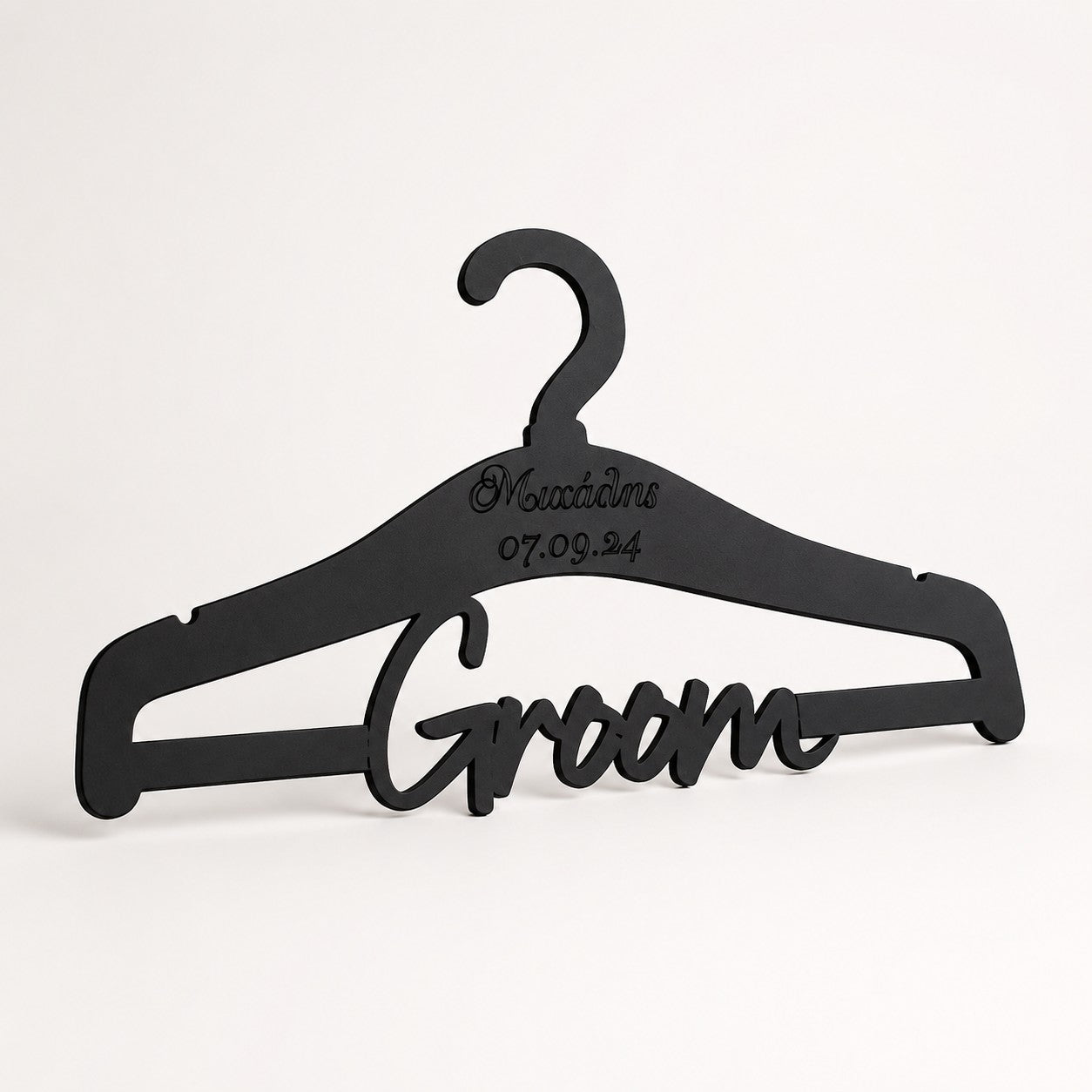 Wooderland personalized matte black wooden wedding groom hanger with custom name and date engraving.