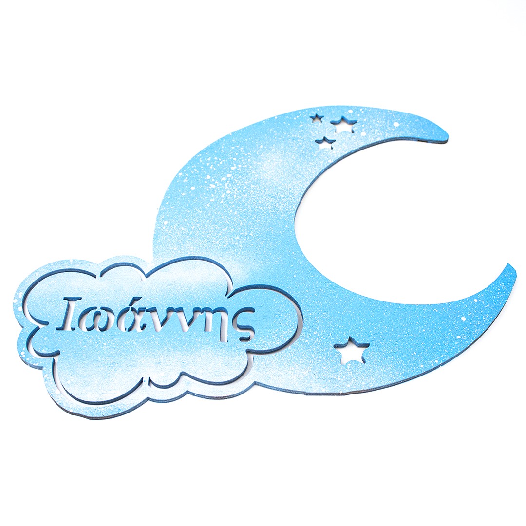 Wooderland laser-cut wooden moon nursery decor in blue with a personalized name on a cloud and star cutouts.