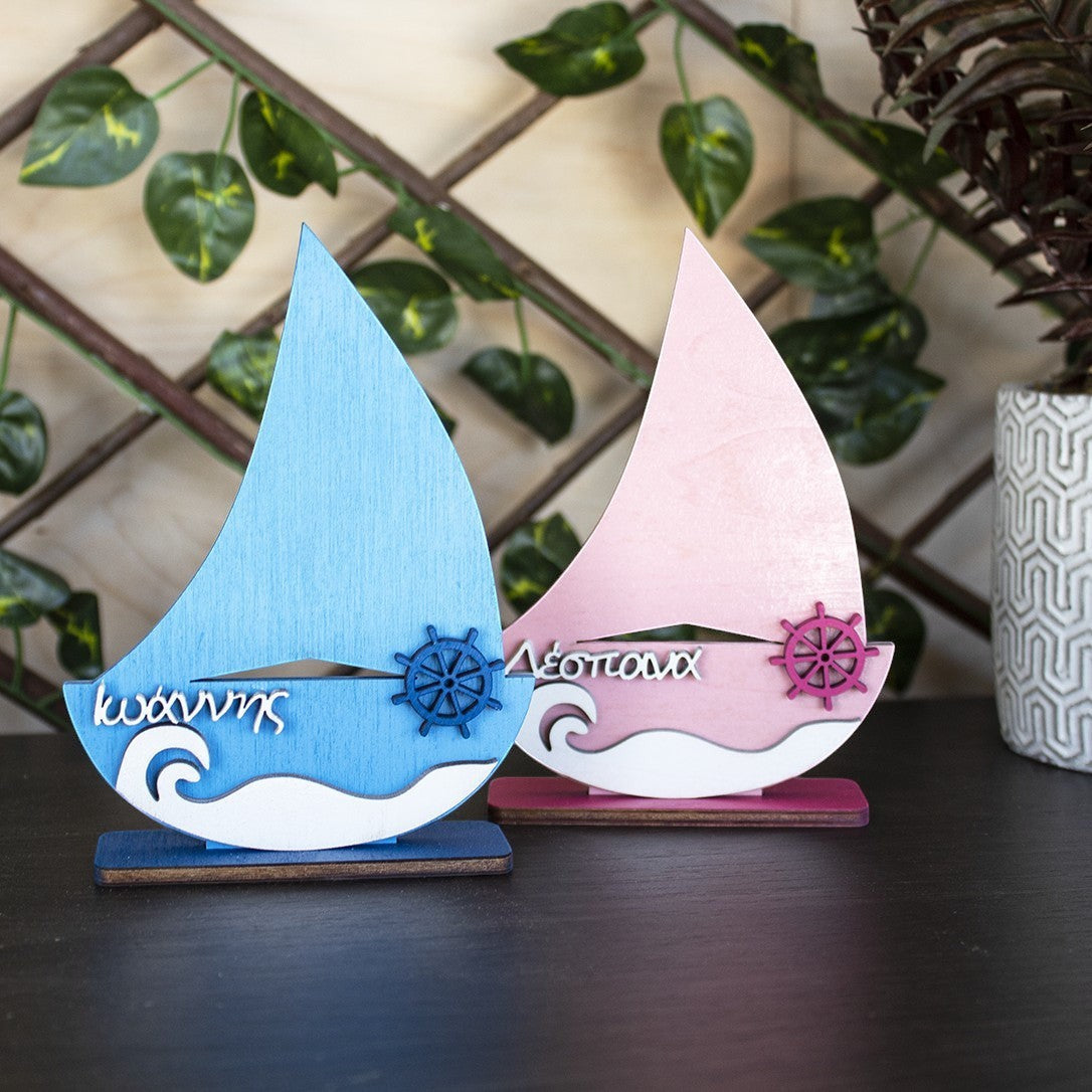 Wooderland handcrafted wooden sailboat nursery decor in blue and pink with personalized name engravings