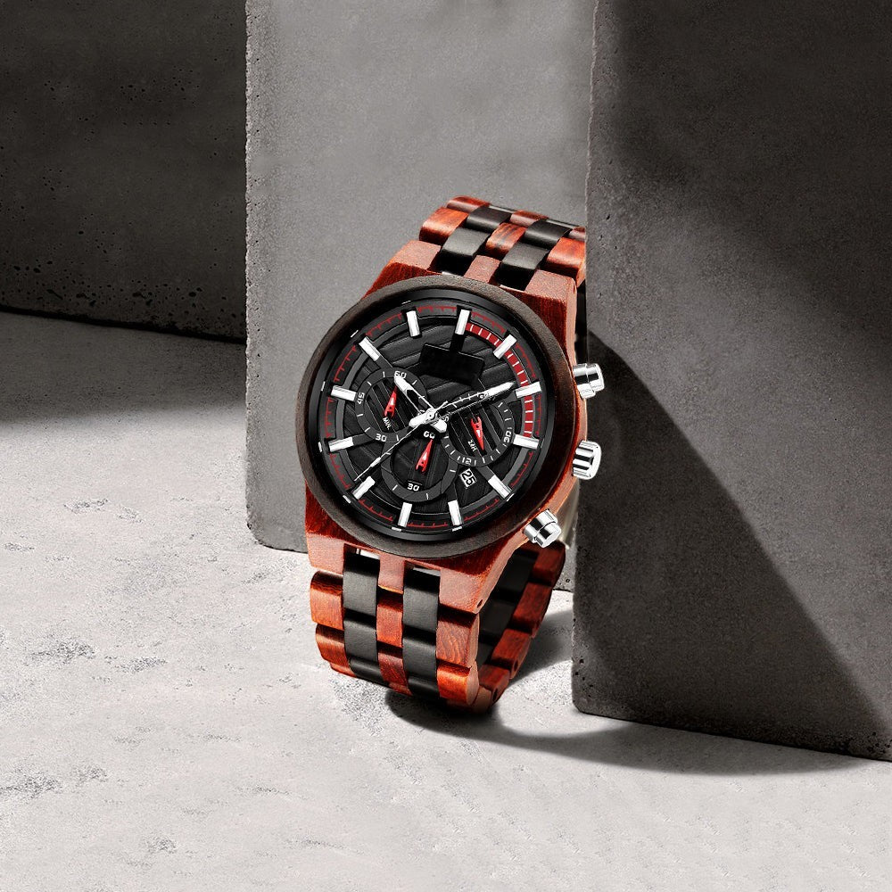 Wooderland Pluto wooden watch with a two-tone brown and black link strap, black multifunctional dial, and red accents.