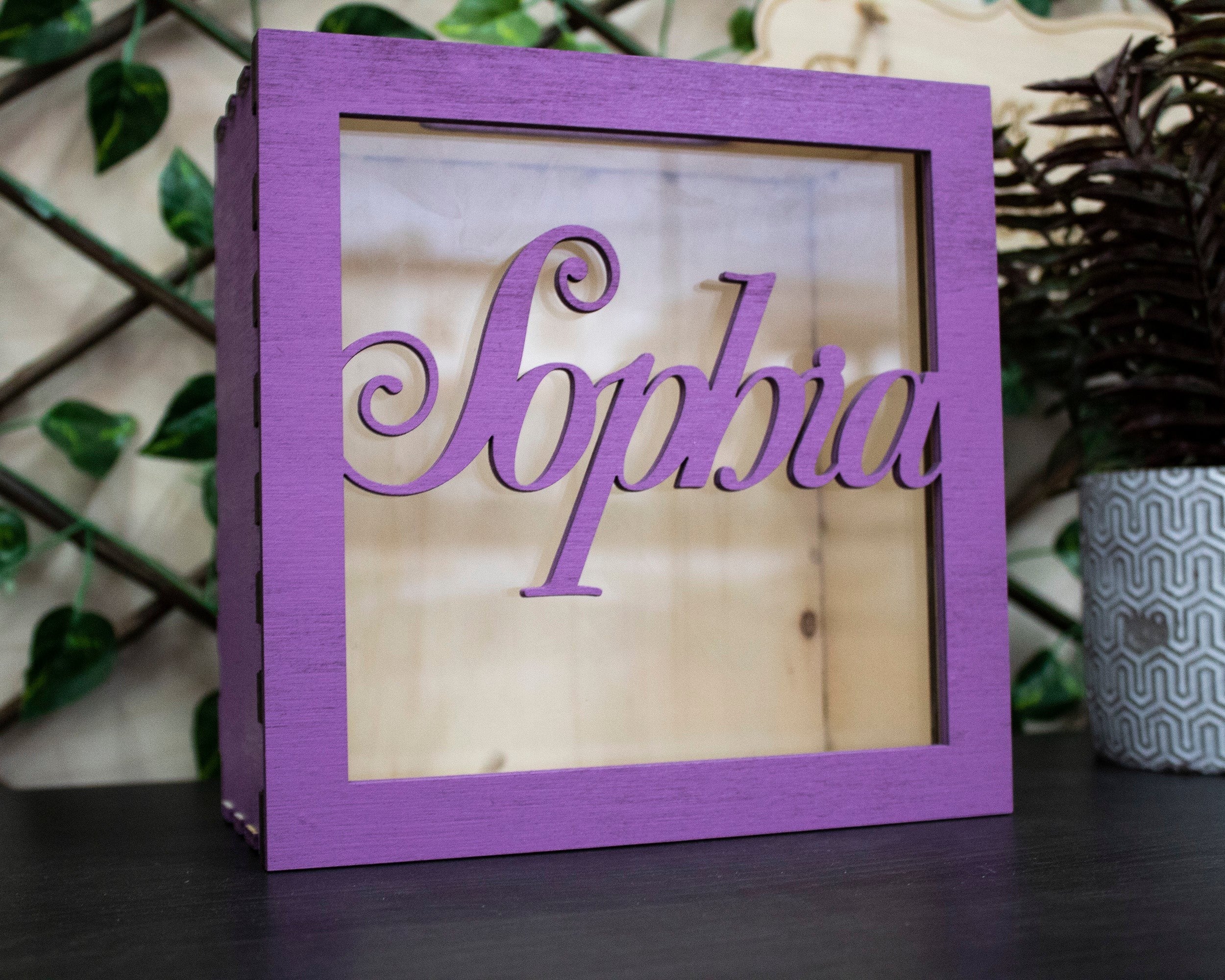 Wooderland purple wooden money box with a clear acrylic front featuring the name Sophia in elegant script lettering