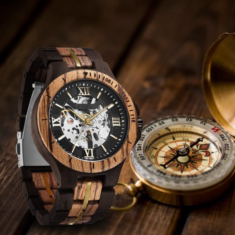Wooderland Saturn automatic wooden watch with a skeleton dial, Roman numerals, and a two-tone wood link strap.