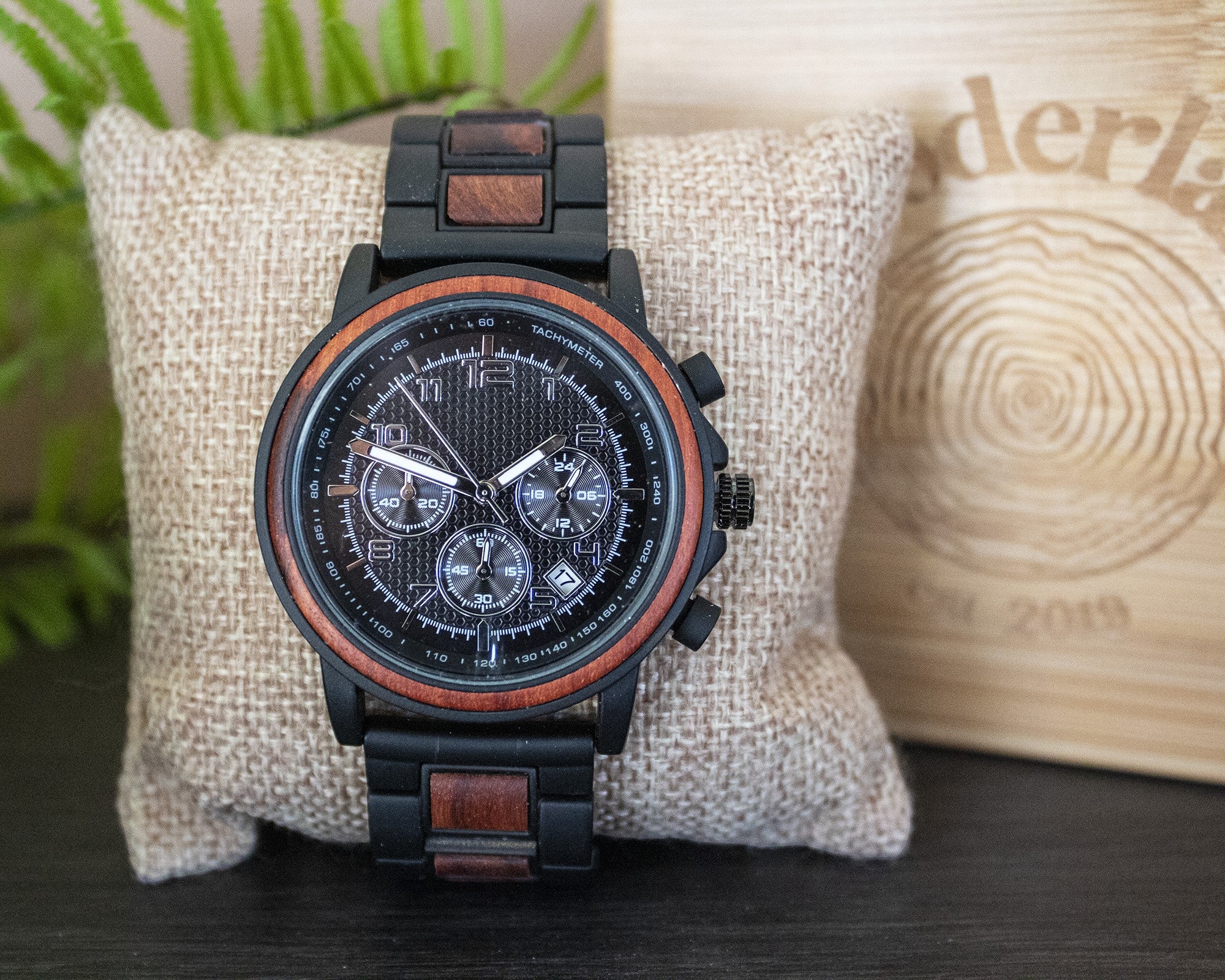 Wooderland Sedna wooden watch with black and brown wood links, multifunctional dial, and mineral glass face.