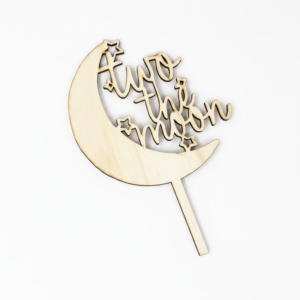 Wooderland Two the Moon wooden cake topper for a 2nd birthday in natural plywood with crescent moon and star design.