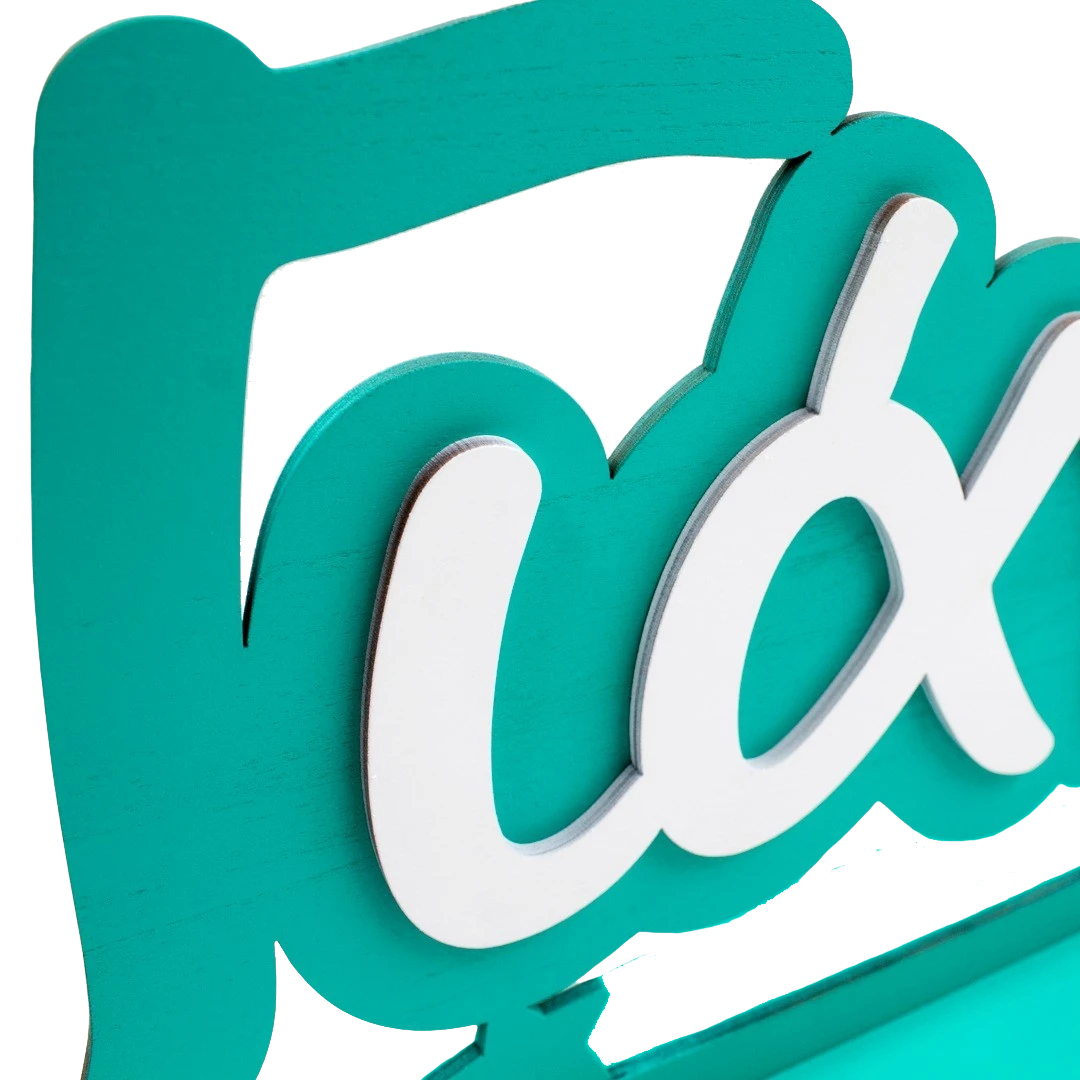 Wooderland custom two-tone wooden name sign with teal and white layered script lettering for nursery decor.