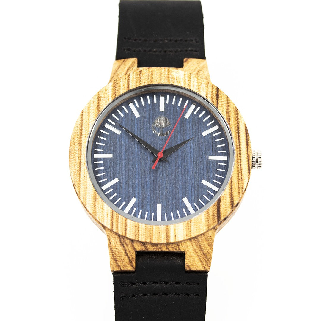 Wooderland Uranus watch with a natural zebra wood case, blue dial, and black leather strap on a white background.