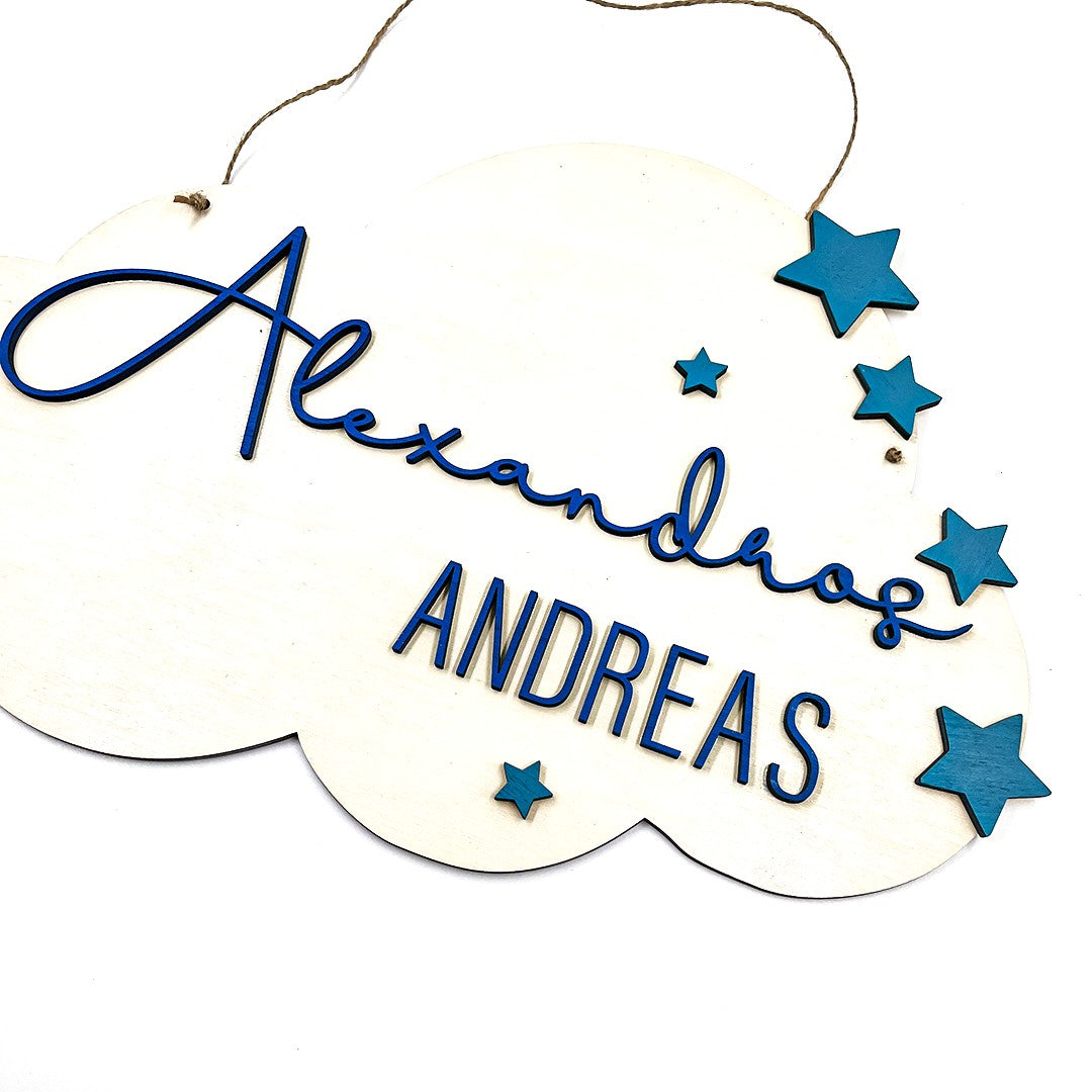 Wooderland custom wooden cloud-shaped bedroom door sign with blue 3D lettering and star accents for kids room decor.
