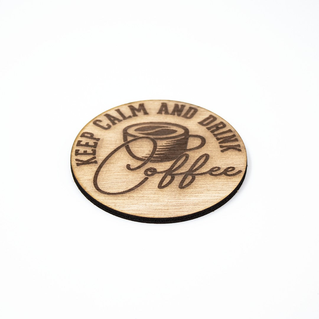 Wooderland rustic wooden coffee coaster with Keep Calm and Drink Coffee engraved design on a white background