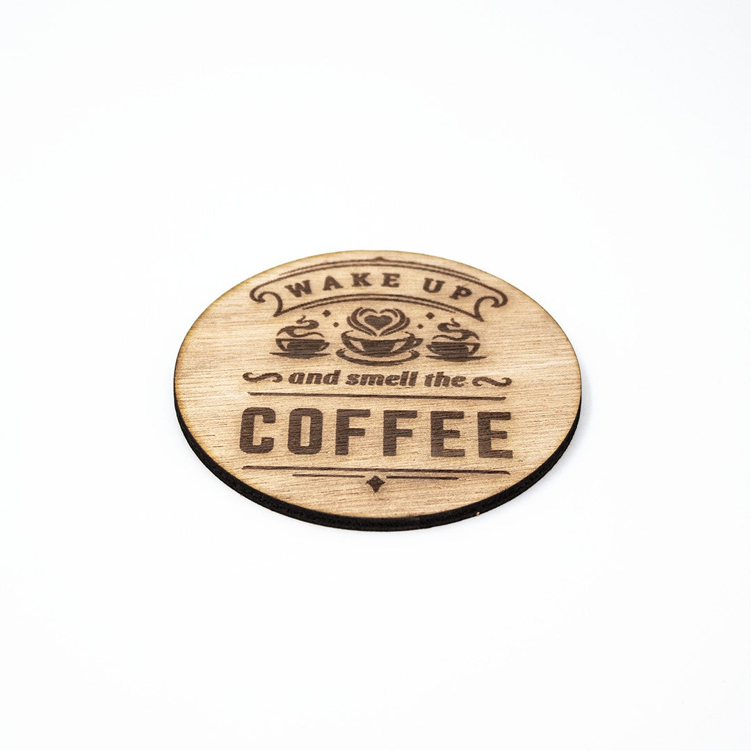 Wooderland rustic wooden coffee coaster with Wake Up and Smell the Coffee laser-engraved design on white background