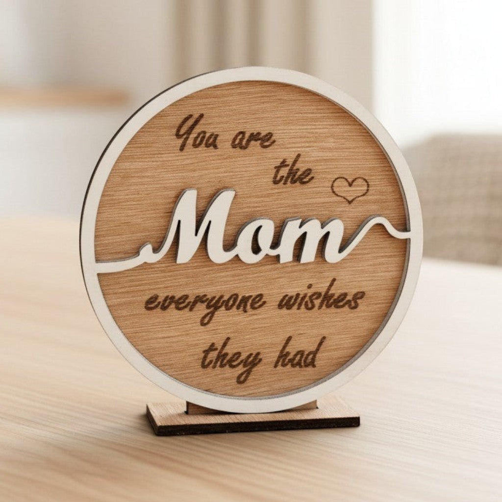 Wooderland wooden circle stand for Mum with engraved heartfelt message and white lettering on a desk