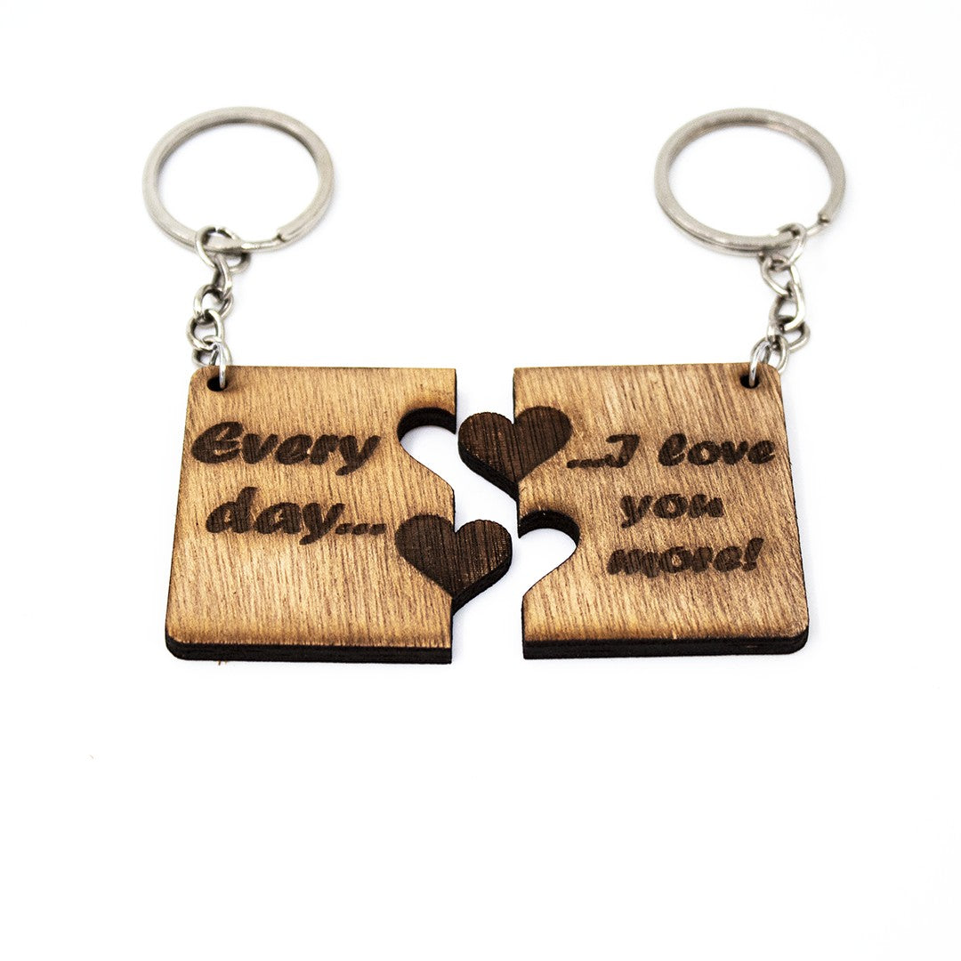 Wooderland matching wooden puzzle piece keyrings engraved with Every day I love you more for couples or best friends.
