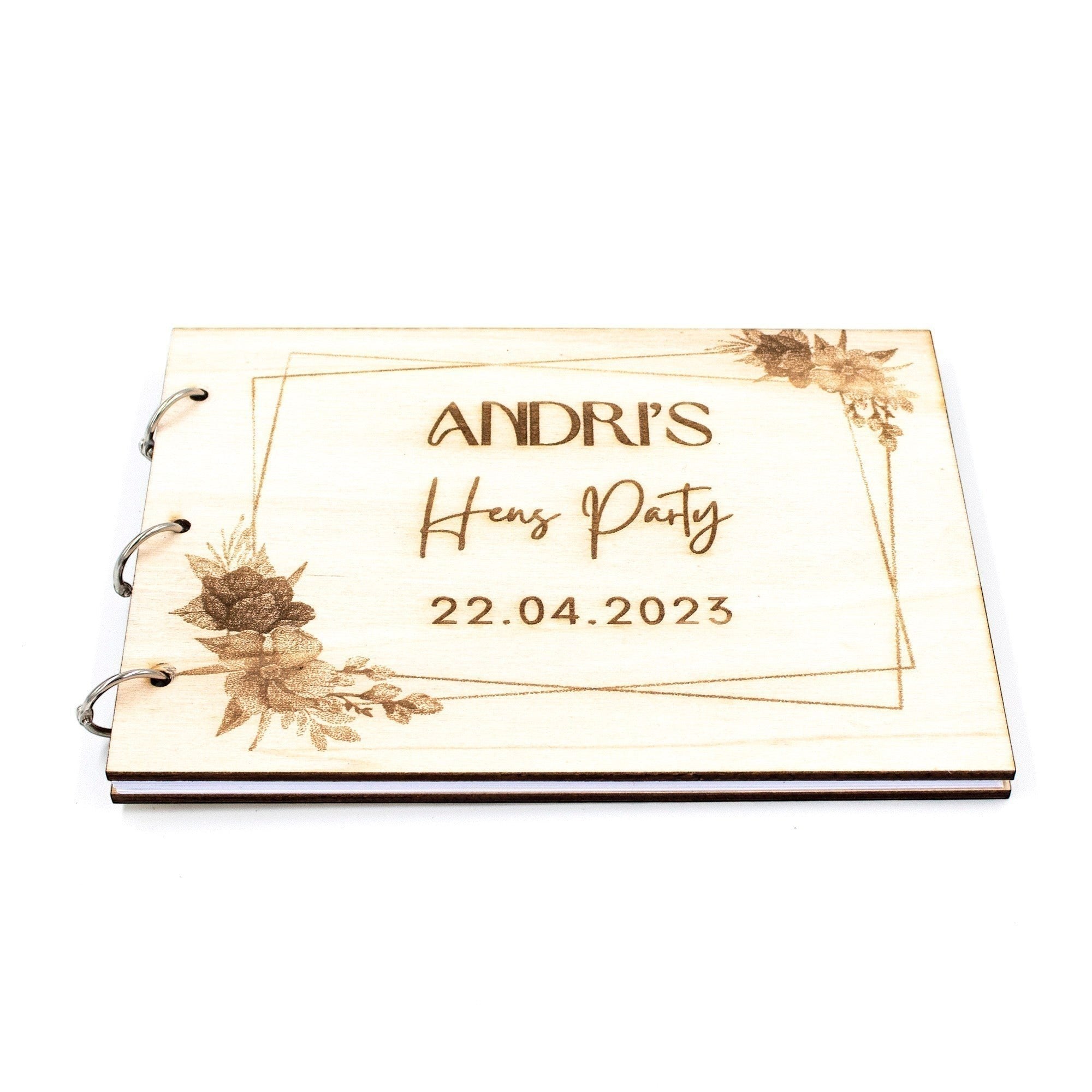Wooderland A5 wooden wish book with custom floral engraving for a hen party, featuring blank pages and metal rings.
