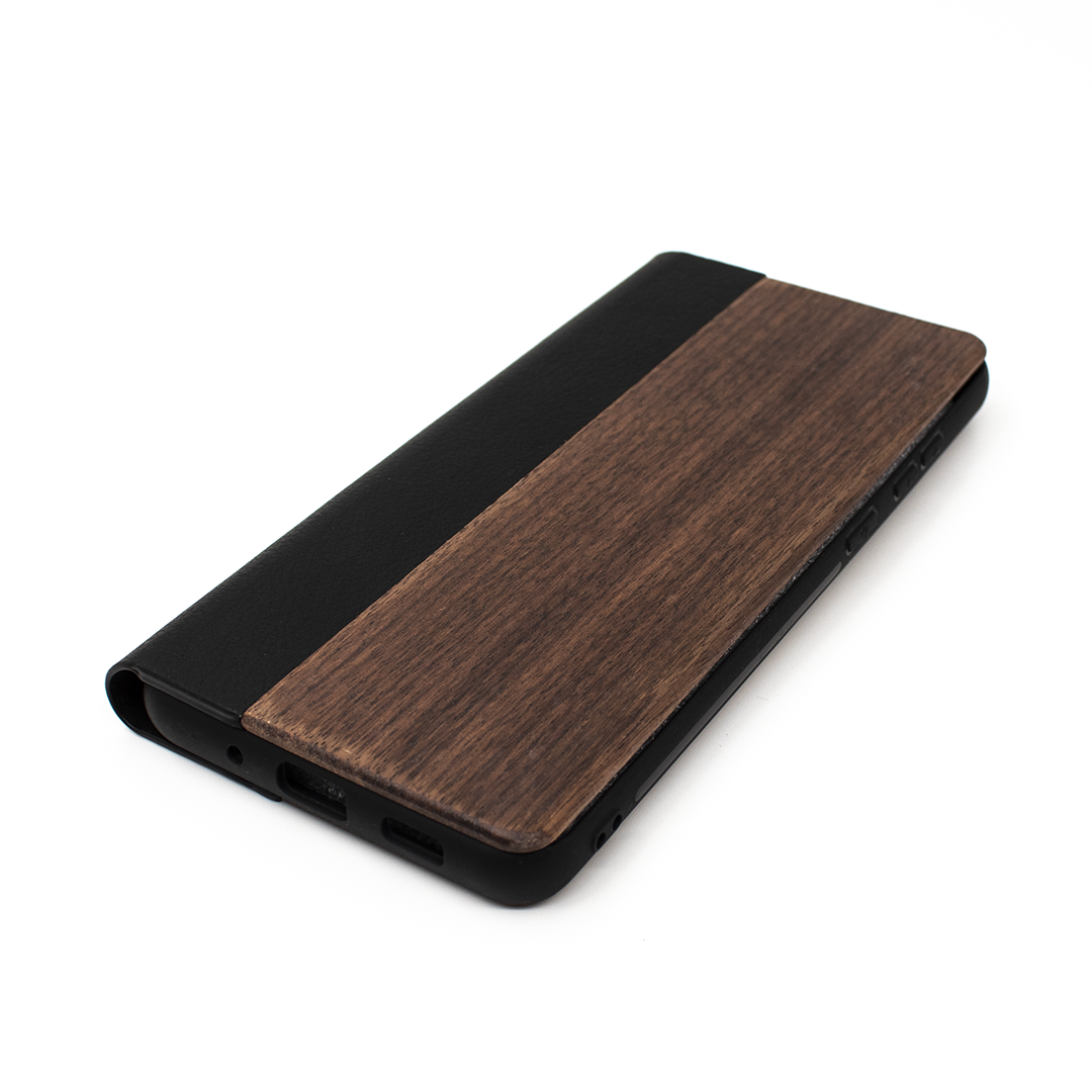 Protect your Samsung S20 Ultra with our premium wooden phone case. Our cases are made from real wood and high-quality materials, providing first-class protection and a natural feel. The unique wood grain and color of each case makes it truly one-of-a-kind. The polycarbonate bumper provides maximum impact resistance, while the ultra-thin and lightweight design ensures a sleek and stylish look. With built-in buttons for volume and snap-on application.