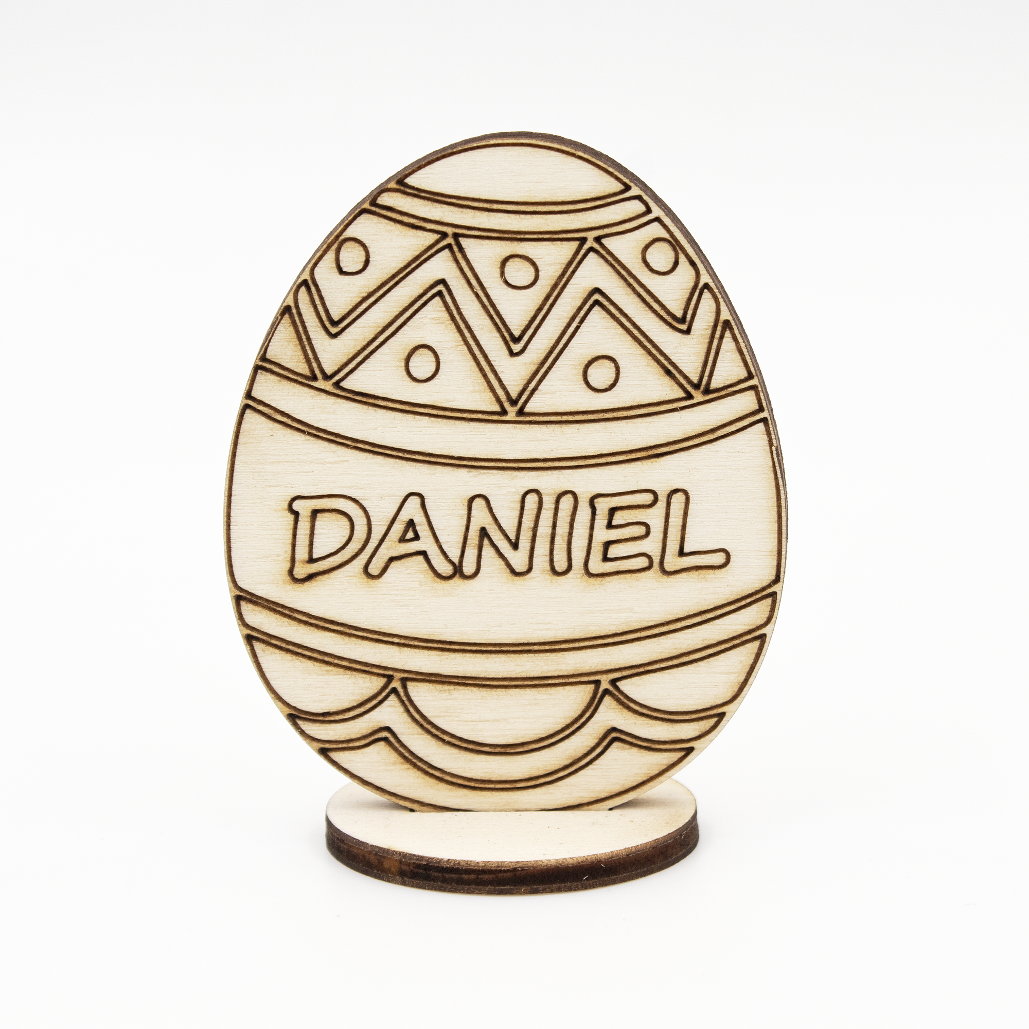 Enhance your Easter celebration with our custom wooden Easter egg stand on a base. Made from high-quality wood, this stylish and durable stand is perfect for displaying your personalized Easter egg. Engrave it with a name or message of your choice for a unique gift that will be cherished for years to come. Whether used as a centerpiece or accent piece for your home decor, this wooden egg stand is sure to impress. Material: Wood.
