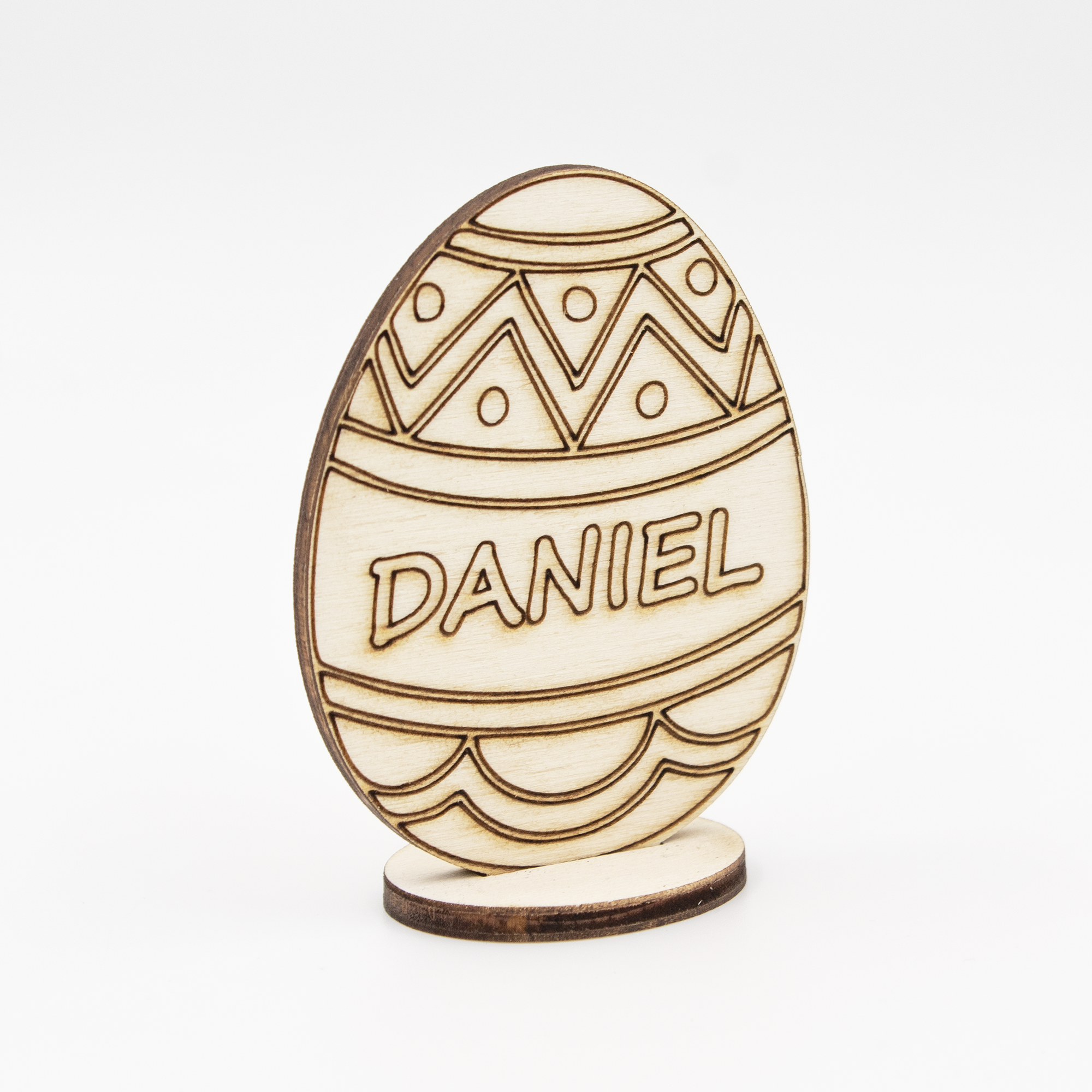Enhance your Easter celebration with our custom wooden Easter egg stand on a base. Made from high-quality wood, this stylish and durable stand is perfect for displaying your personalized Easter egg. Engrave it with a name or message of your choice for a unique gift that will be cherished for years to come. Whether used as a centerpiece or accent piece for your home decor, this wooden egg stand is sure to impress. Material: Wood.
