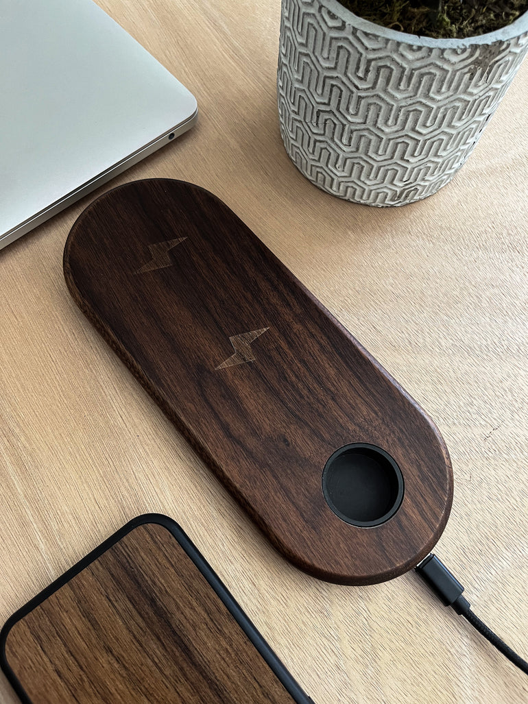 Organize and charge your Apple devices with this high-quality wooden 3-in-1 wireless charger for iPhone, AirPods, and Apple Watch. The stylish and functional charging station features a non-slip surface, and is the perfect solution to declutter your space. Say goodbye to tangled cords and hello to this sleek and natural charging solution.